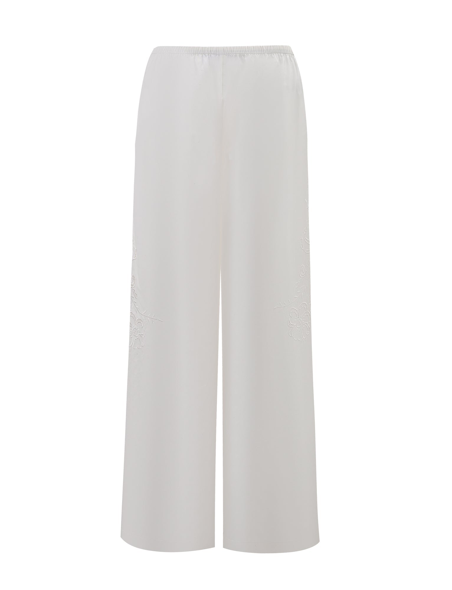 The CRESSY PANT - WHITE by TIGERMIST features a wide-leg, straight, relaxed fit in lightweight cotton with an elastic waistband and subtle embroidery, shown on a plain white background.