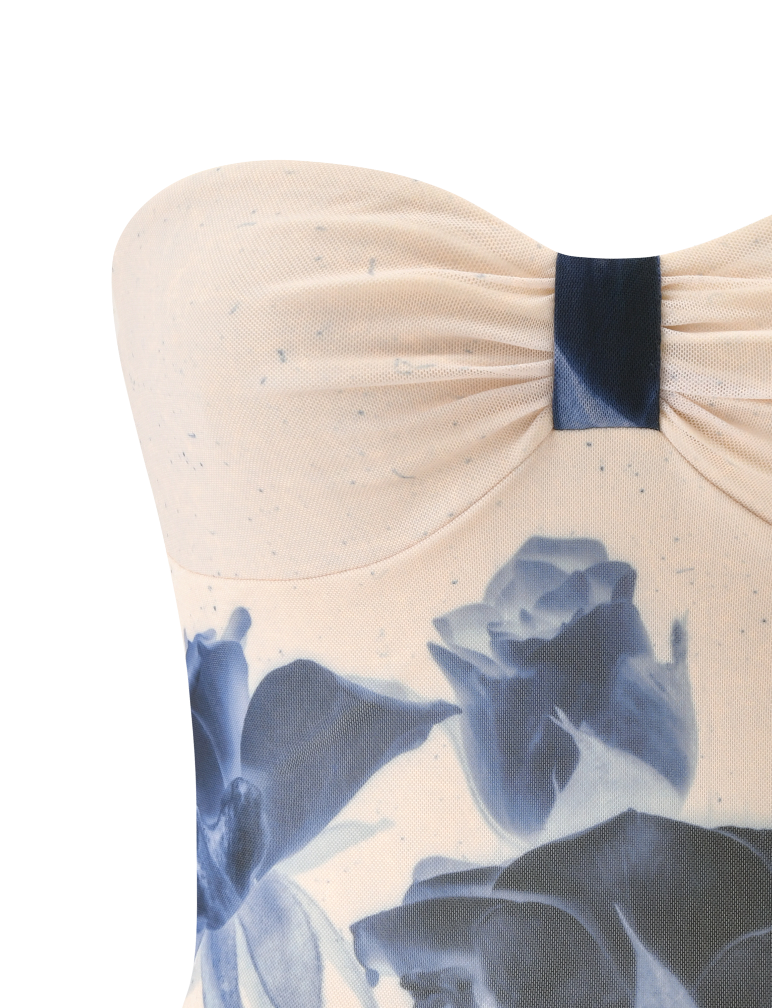 Close-up of the JANIS TOP - INDIGO FLORAL by TIGERMIST, a strapless sweetheart tube top with a gathered, ruched bodice in light beige featuring a bold blue floral print.