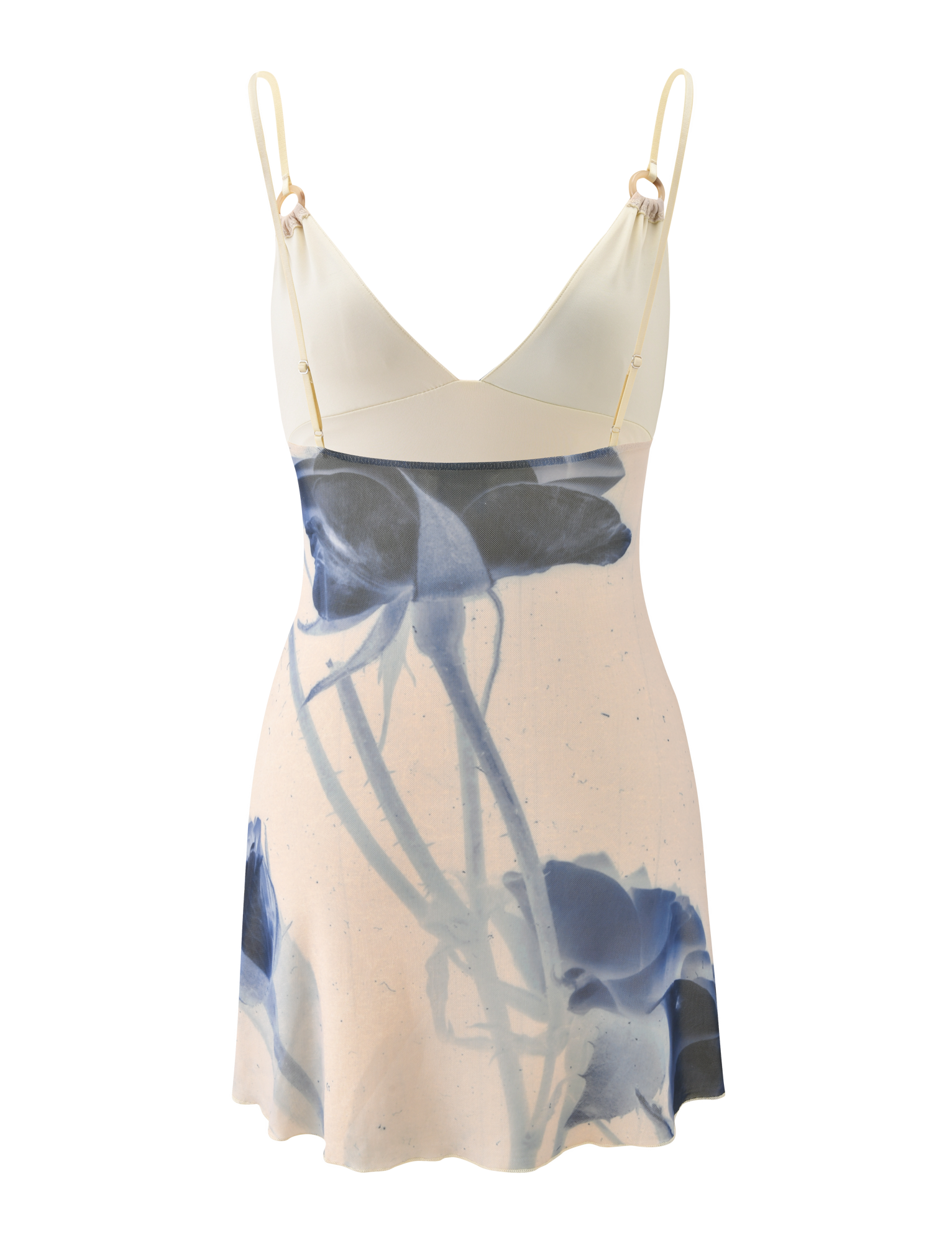 The TIGERMIST ROSY MINI DRESS - INDIGO FLORAL is a sleeveless mini dress with adjustable cami straps, a cream top, and a blue rose print skirt on a light background.