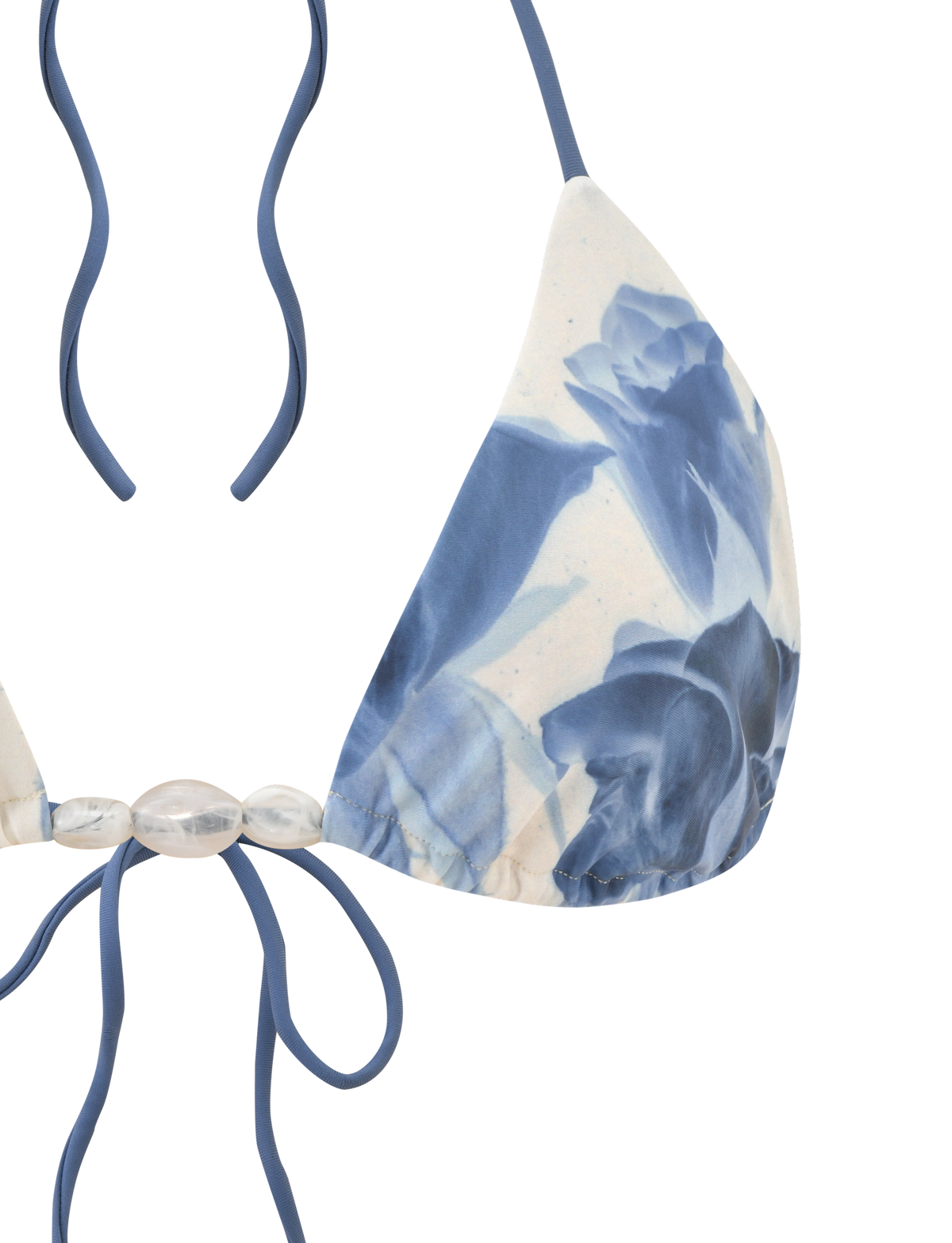 A close-up of the TIGERMIST CYLAS BIKINI TOP - INDIGO FLORAL, featuring adjustable triangle cups with blue floral prints, halter neck ties, and clear bead accents.