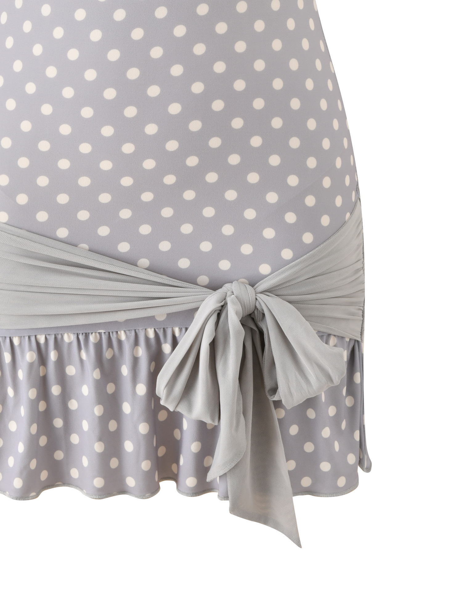 Close-up of the TIGERMIST TOVE MINI DRESS in dove grey with cream dots, strapless design, ruffle hem, and a matching sash bow at the waist.