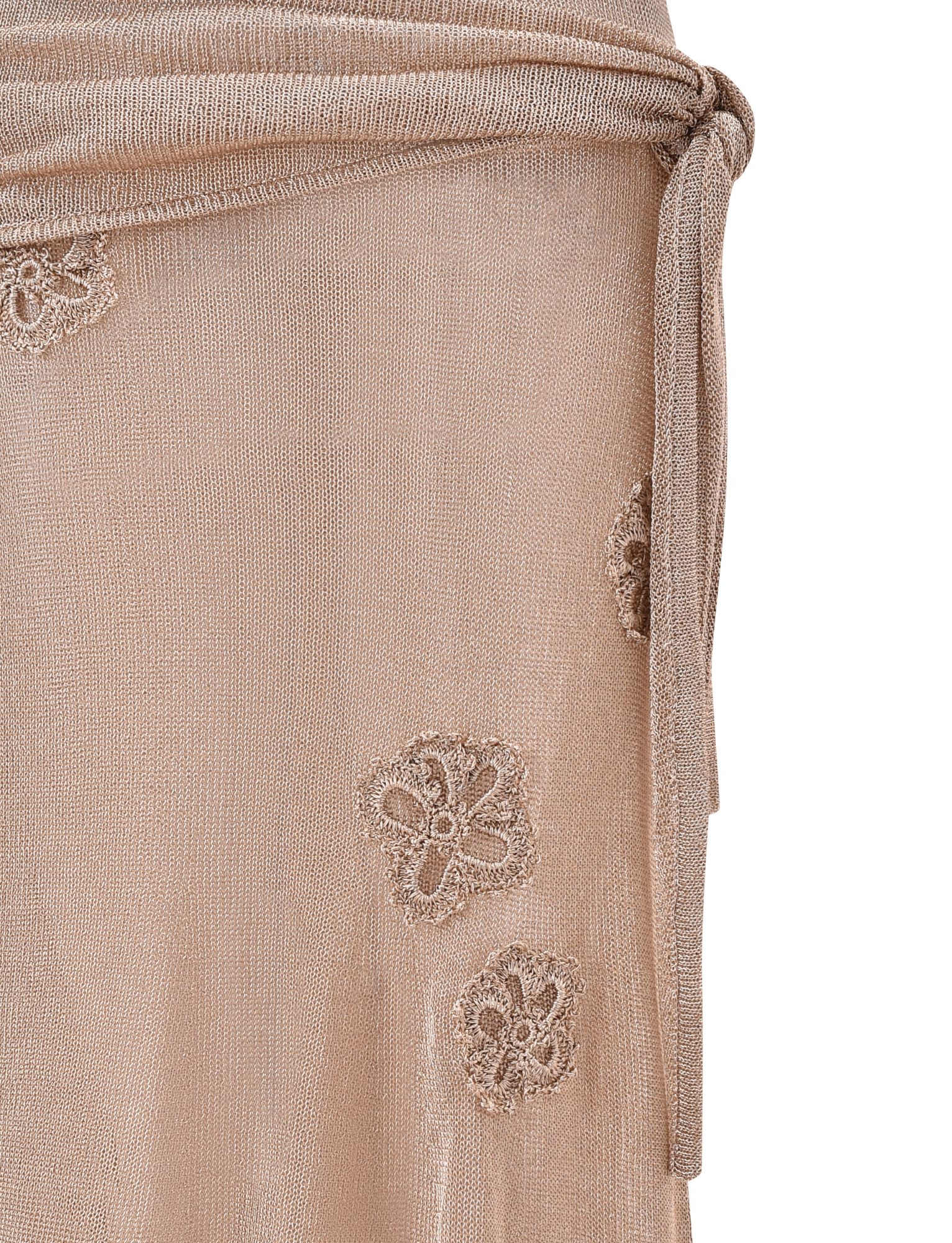 Close-up of the ISATANA SKIRT - GOLD by TIGERMIST, featuring beige sheer fabric with a tied belt, delicate floral embroidery, and an asymmetrical layered design. Lightweight and slightly transparent texture.