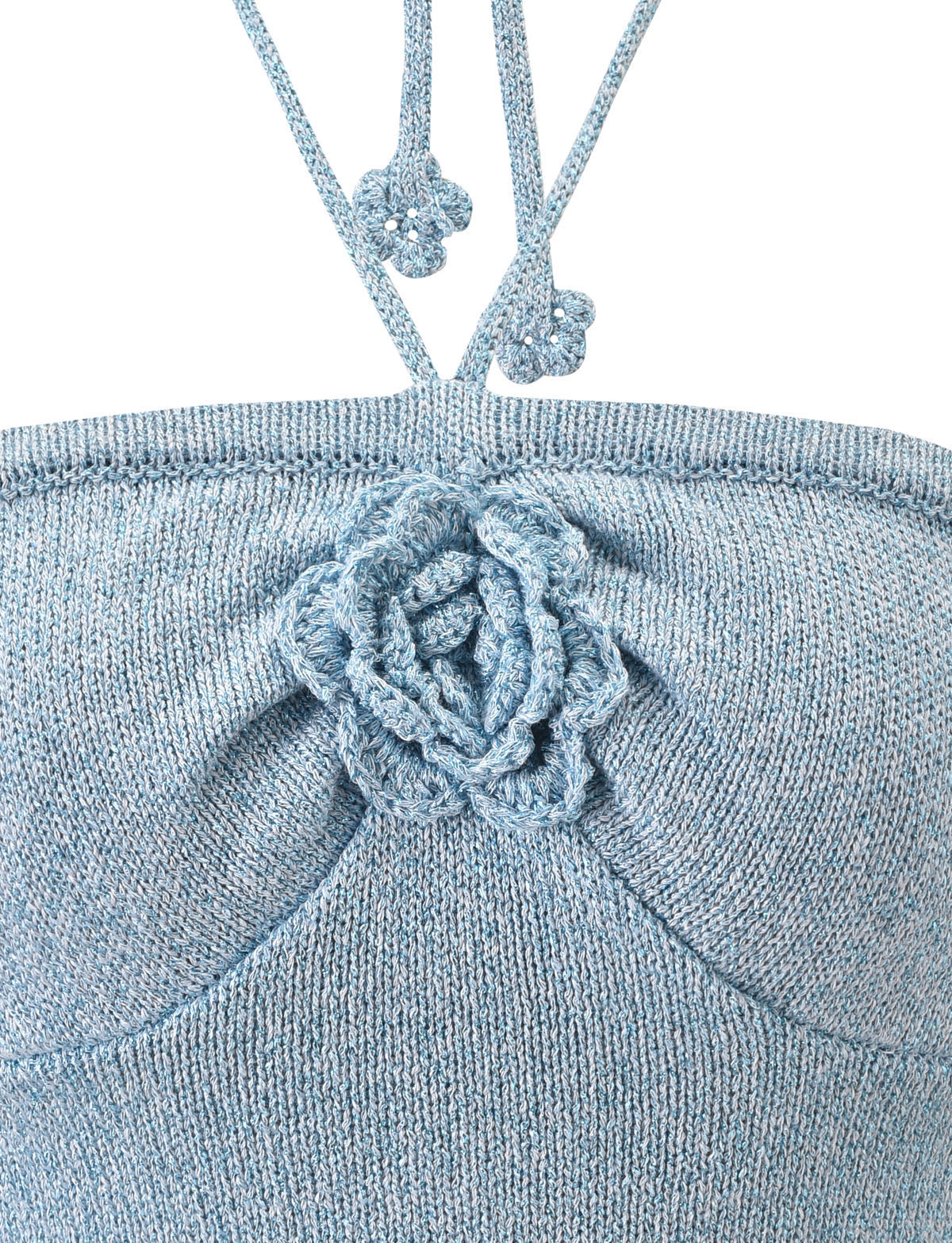 Close-up of the TIGERMIST SUNIA TOP - BLUE: a light blue knitted bandeau with a central crocheted rose appliqué and two thin straps, each topped with small crochet flowers.