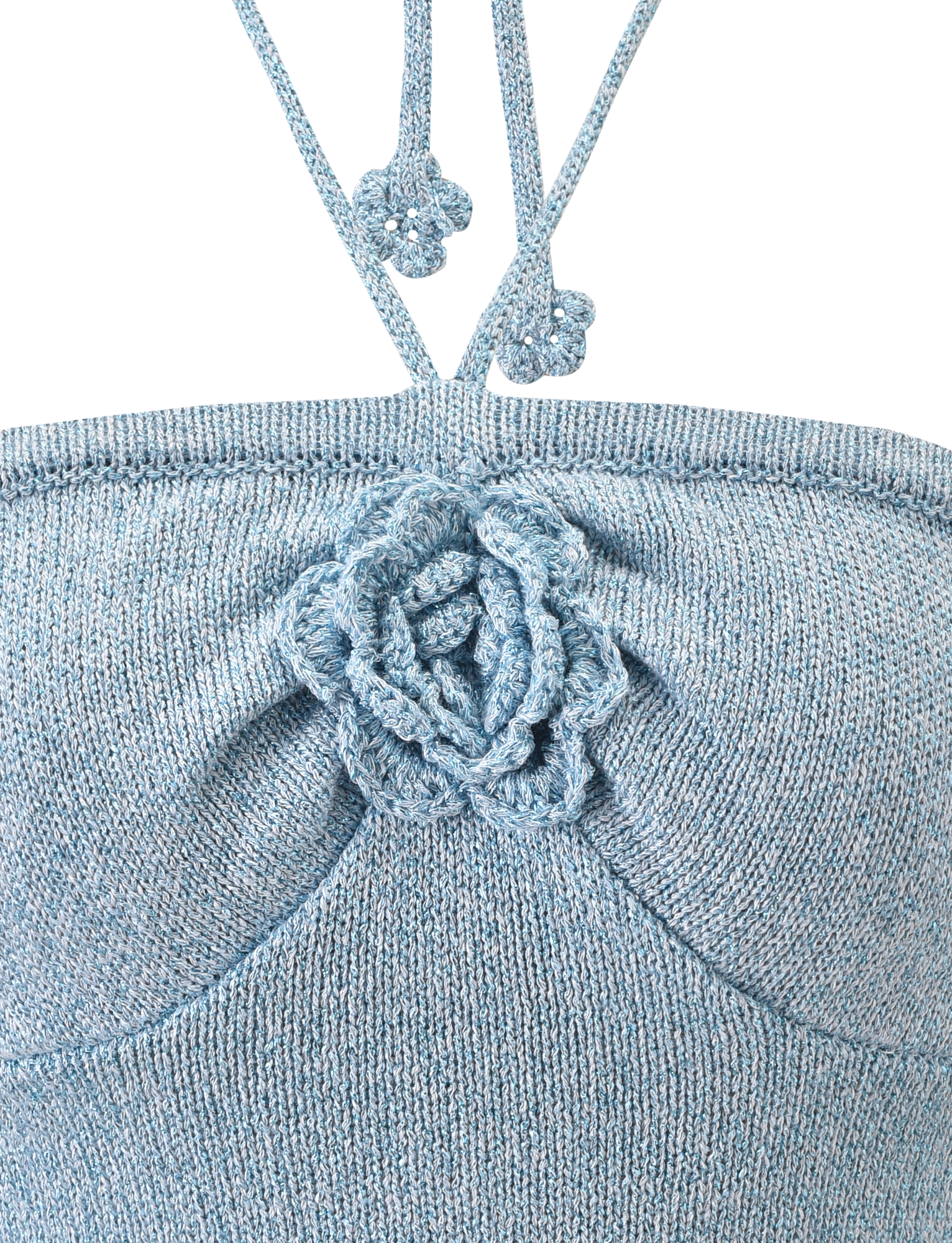 Close-up of the TIGERMIST SUNIA TOP - BLUE: a light blue knitted bandeau with a central crocheted rose appliqué and two thin straps, each topped with small crochet flowers.