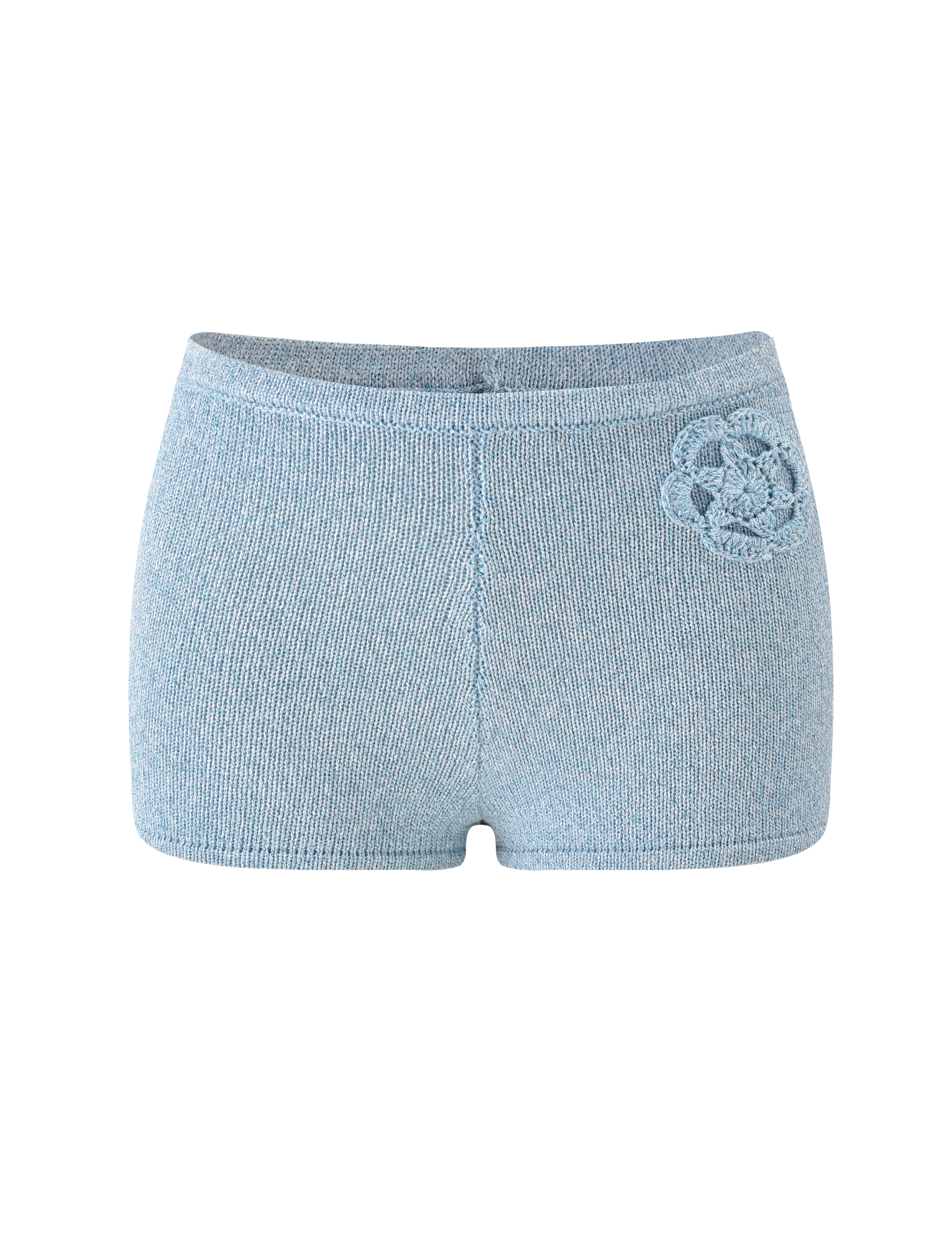 The TIGERMIST SUNIA SHORT - BLUE features ultra-mini, light blue hot shorts with a high waist and a subtle crocheted flower appliqué on the left hip, showcased against a plain white background.