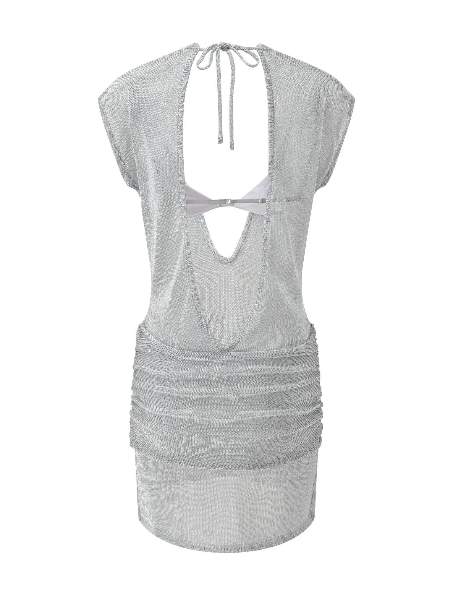 The ZOSIA MINI DRESS by TIGERMIST is a sheer silver knit mini dress with cap sleeves, an open back with neck tie, draped and twisted drop waist, and a scooped back cutout featuring a visible strap across the upper back.