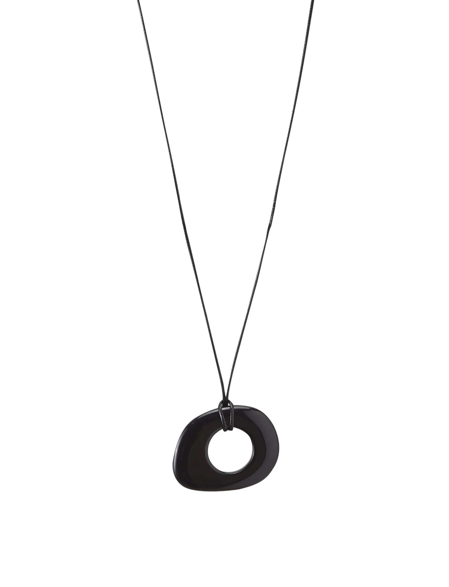 The FAELLA PENDANT NECKLACE - BLACK by TIGERMIST features a minimalist, irregular oval black resin pendant with a central hole on an adjustable cord, showcased against a plain white background.