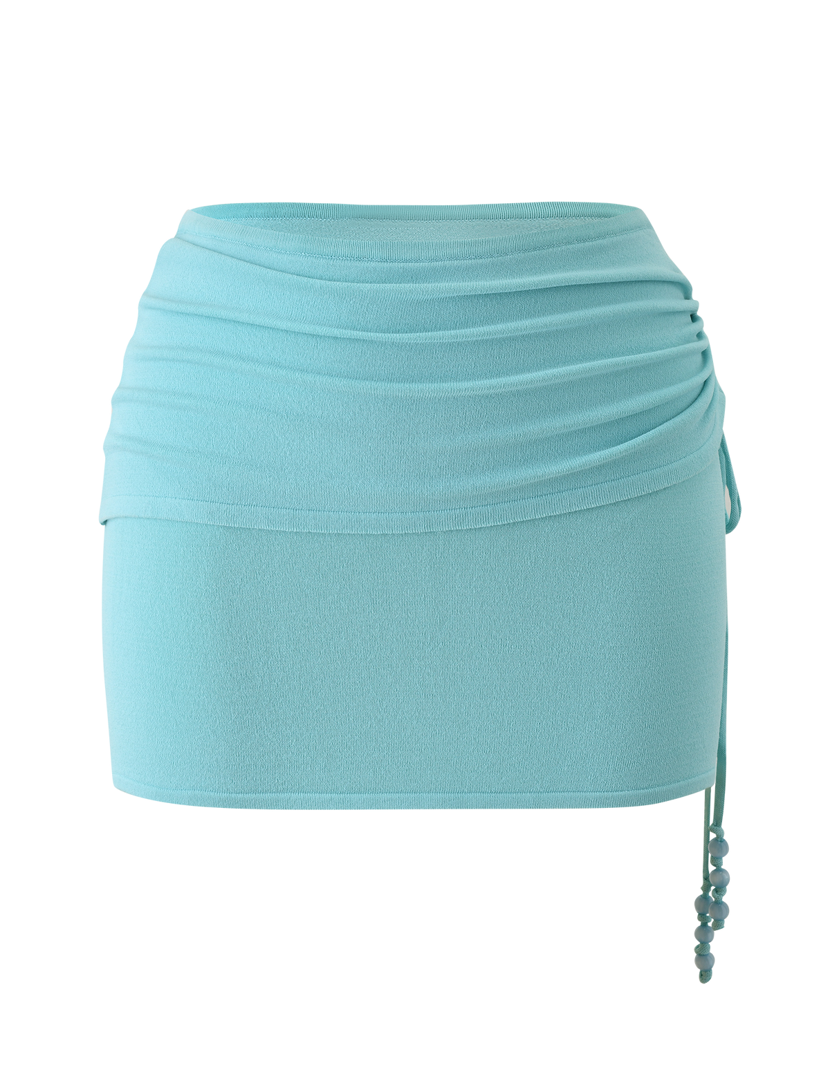 The TIGERMIST JASMINA KNIT MINI SKIRT - BLUE features a light blue knit fabric, ruched waistband, fitted silhouette, and beaded side drawstring ties, shown against a plain white background.
