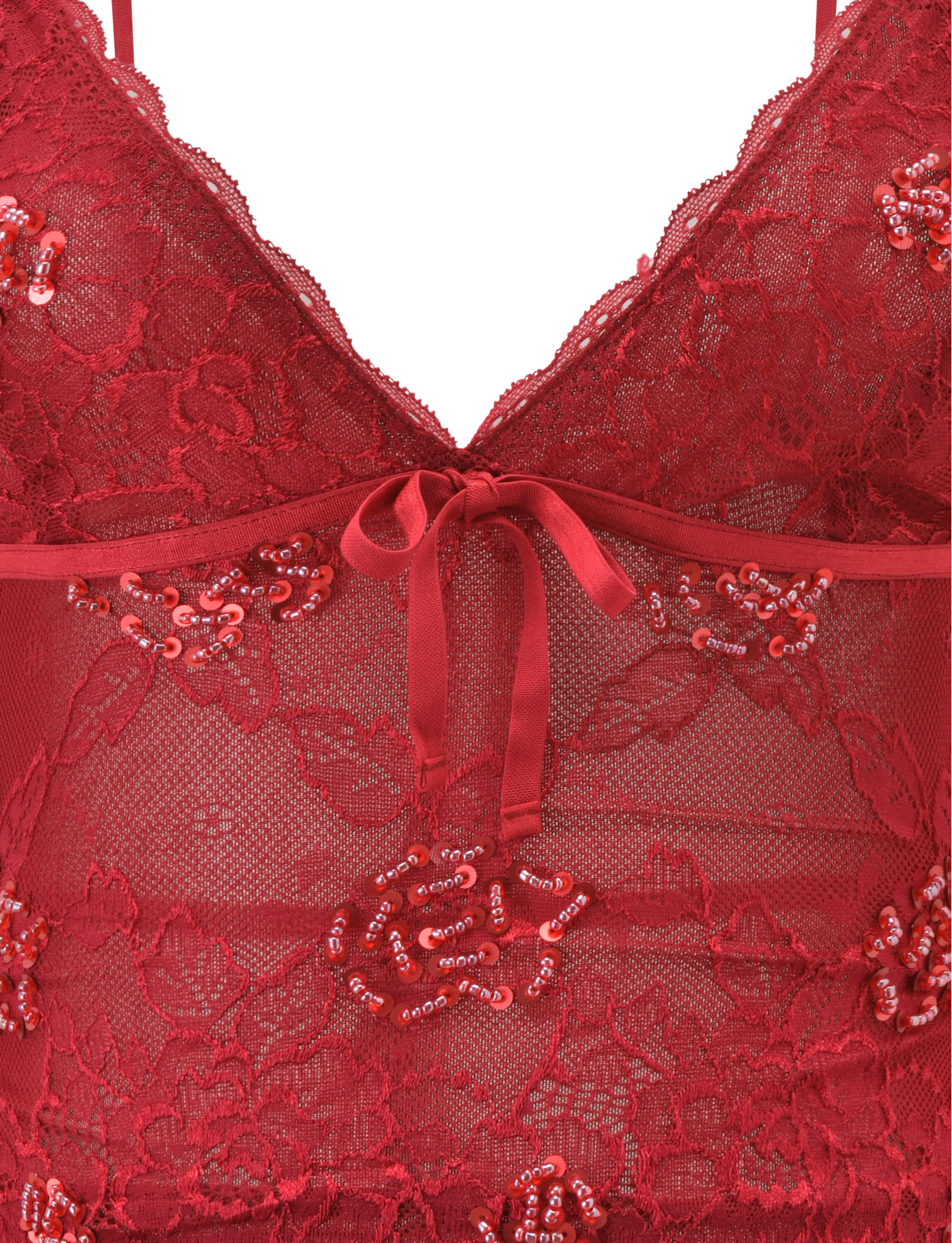 Close-up of the TIGERMIST KIRRA BEADED SEQUIN LACE TOP in red, featuring floral lace, bead and sequin embellishments, a sheer mesh panel, and a small satin bow at the center front.