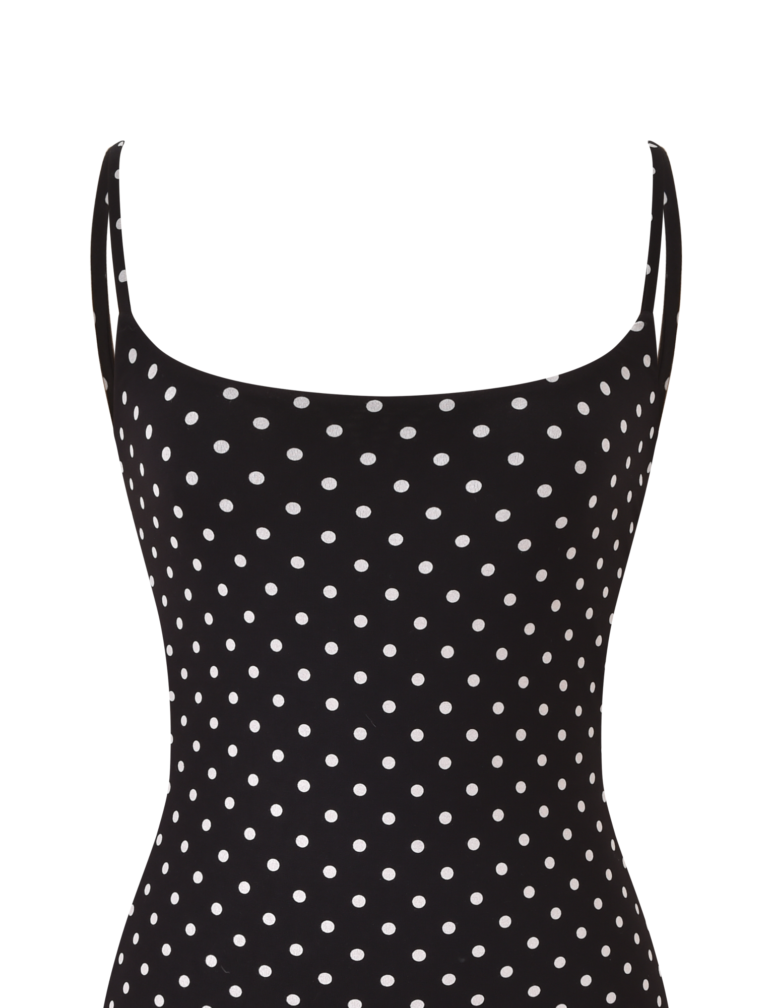 A close-up of the TIGERMIST MINERVA MINI DRESS 2.0 in black polka dot, featuring adjustable shoulder straps, white spots, and a straight neckline.