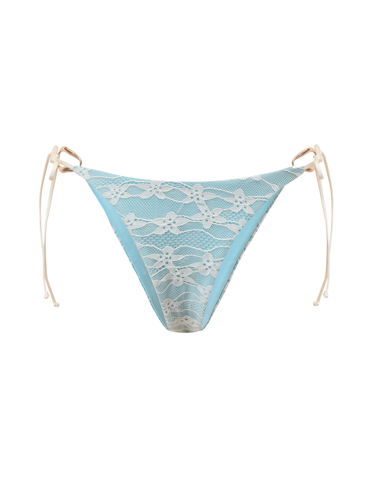 The SIKA BIKINI BOTTOM - BLUE LACE by TIGERMIST features a light aqua blue cheeky cut with white lace overlay and beige side ties, shown against a plain white background.