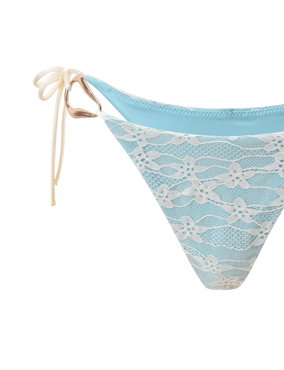 The TIGERMIST SIKA BIKINI BOTTOM - BLUE LACE features a cheeky cut, white lace overlay, side-tie detail, and a gold heart-shaped ring accent on the hip.