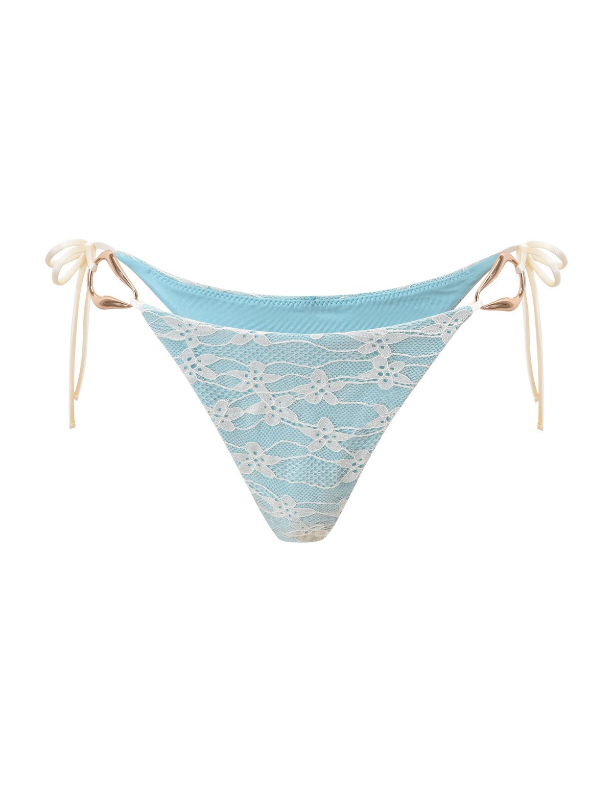 The SIKA BIKINI BOTTOM - BLUE LACE by TIGERMIST features aqua blue fabric, a white floral lace overlay, and cream side ties. With a cheeky cut, it creates a stylish summer look, shown here on a white background.