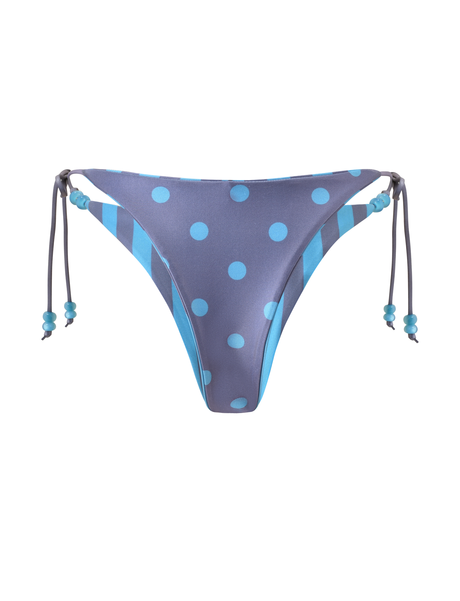 The TIGERMIST FINLEA REVERSIBLE BIKINI BOTTOM in blue grey features dot and stripe patterns, beaded side tie strings, and a cheeky cut with alternating solid and striped sides.