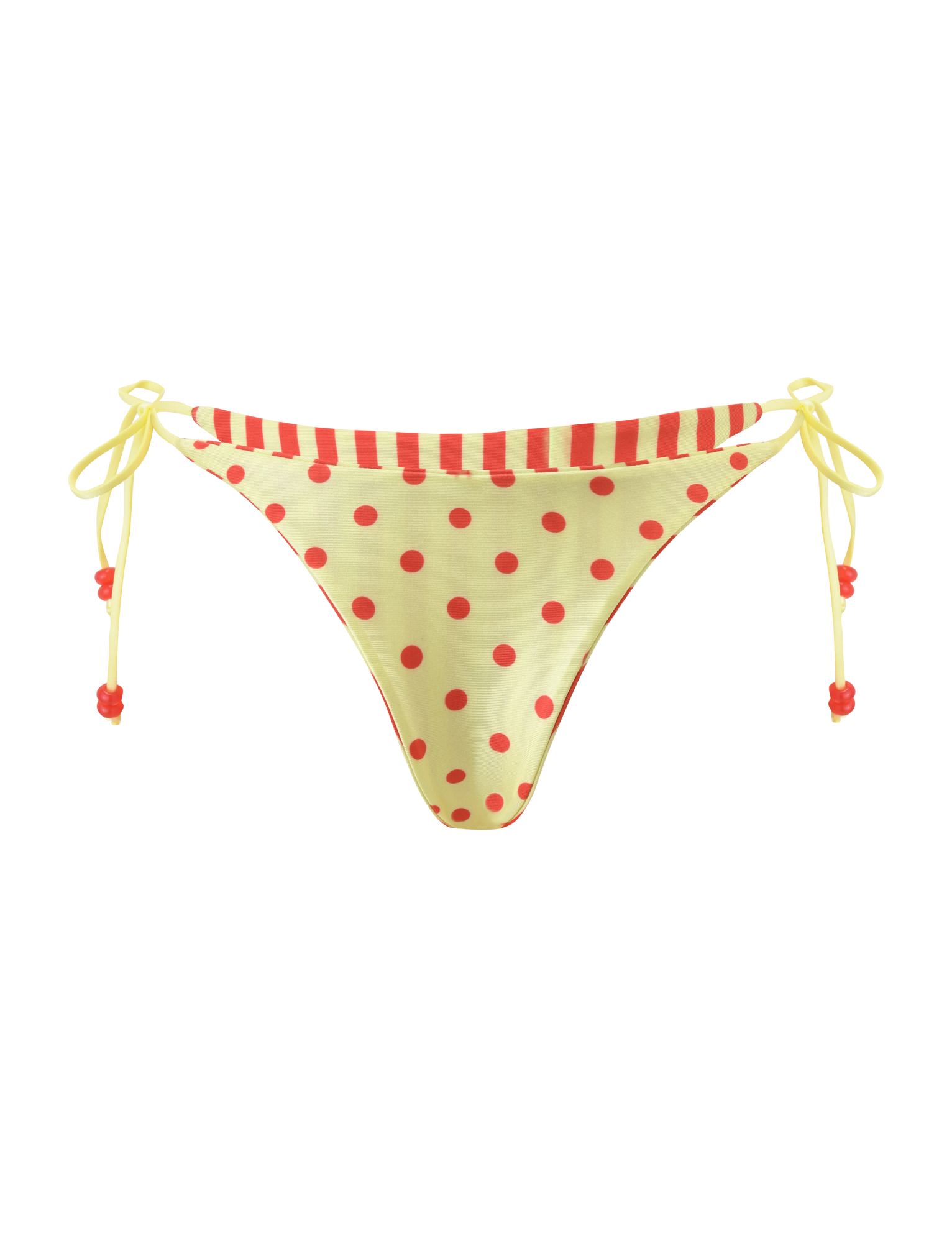 The FINLEA REVERSIBLE BIKINI BOTTOM by TIGERMIST features a cheeky cut with yellow polka dots, a red-striped waistband, and yellow side ties with red beads, shown on a plain white background.