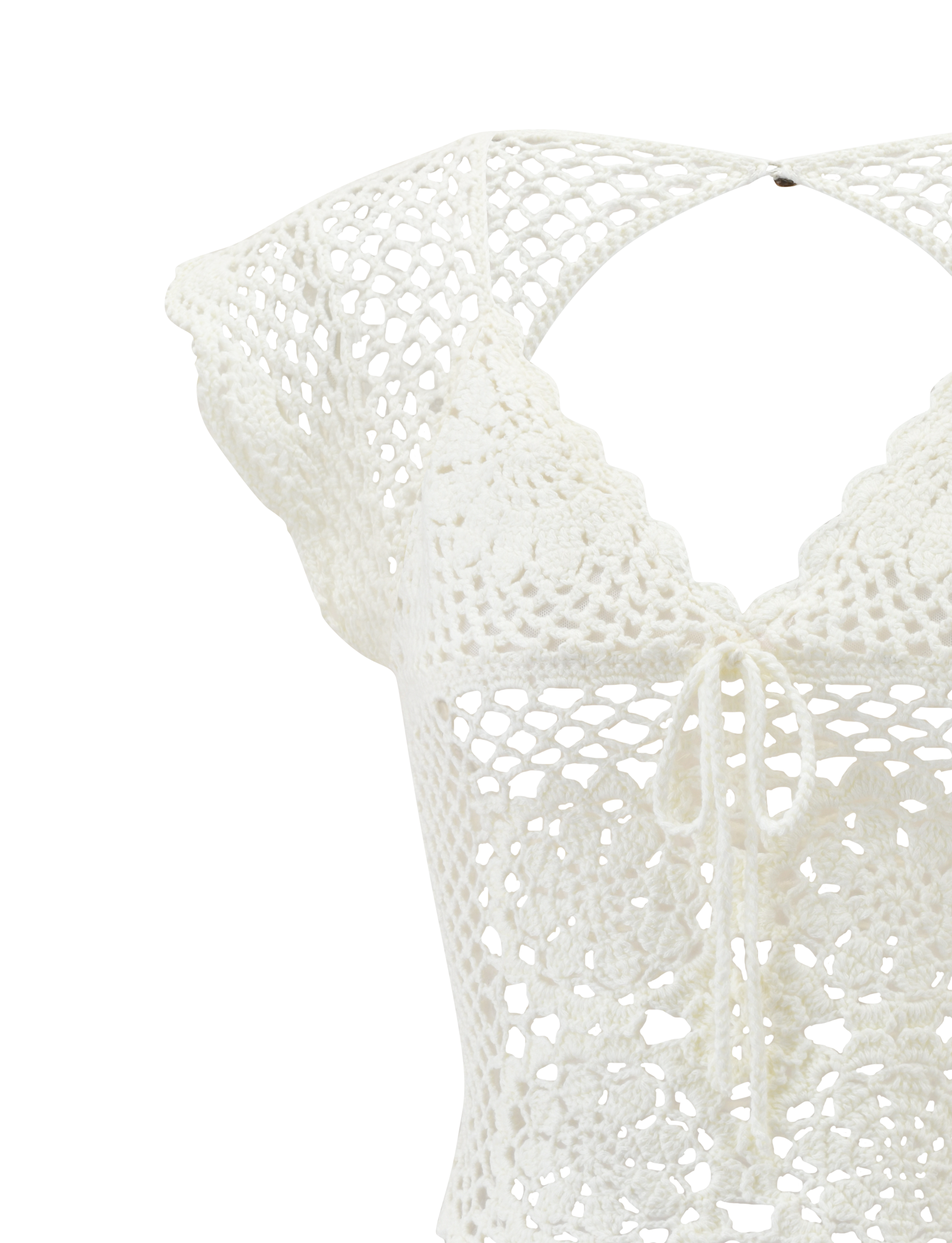 Close-up of the SASHA CROCHET TOP - IVORY by TIGERMIST, featuring scalloped cap sleeves, a V-neckline, corset-style front tie, and intricate floral and geometric crochet patterns.