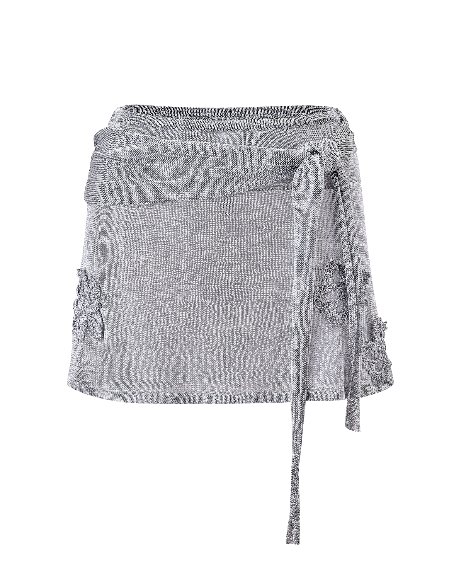 The TIGERMIST ISATANA MINI SKIRT - SILVER features a light gray metallic knit, wrap-around design, long right-side tie belt, and lace embroidery on both hips, shown against a plain white background.