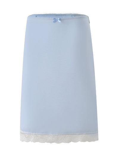 CL - LEISEL SKIRT by Tiger Mist USA in light blue, featuring a small bow at the waistband, lace trim at the hem, and a smooth, minimalist design, displayed on a white background.