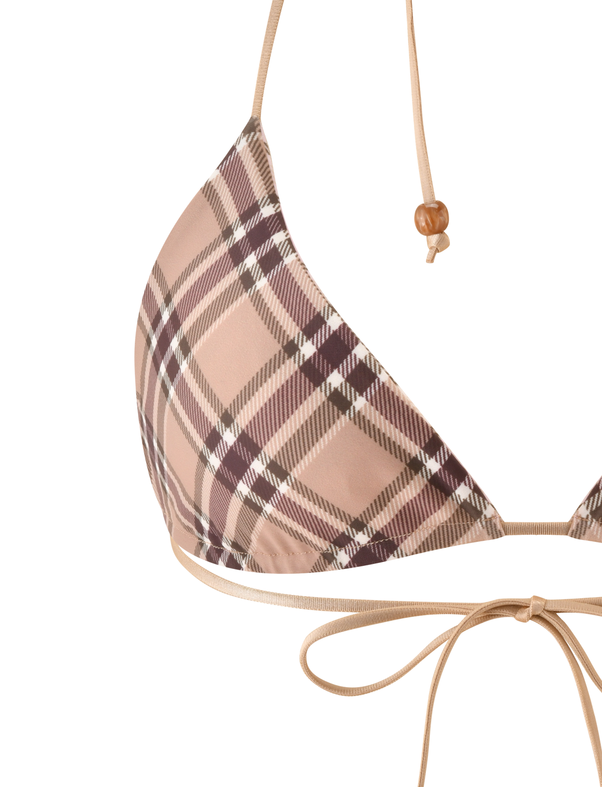 Close-up of the TIGERMIST AVE REVERSIBLE BIKINI TOP in tan and pink plaid. It features thin beige straps, one with a wooden bead, and a bow tied at the bottom.