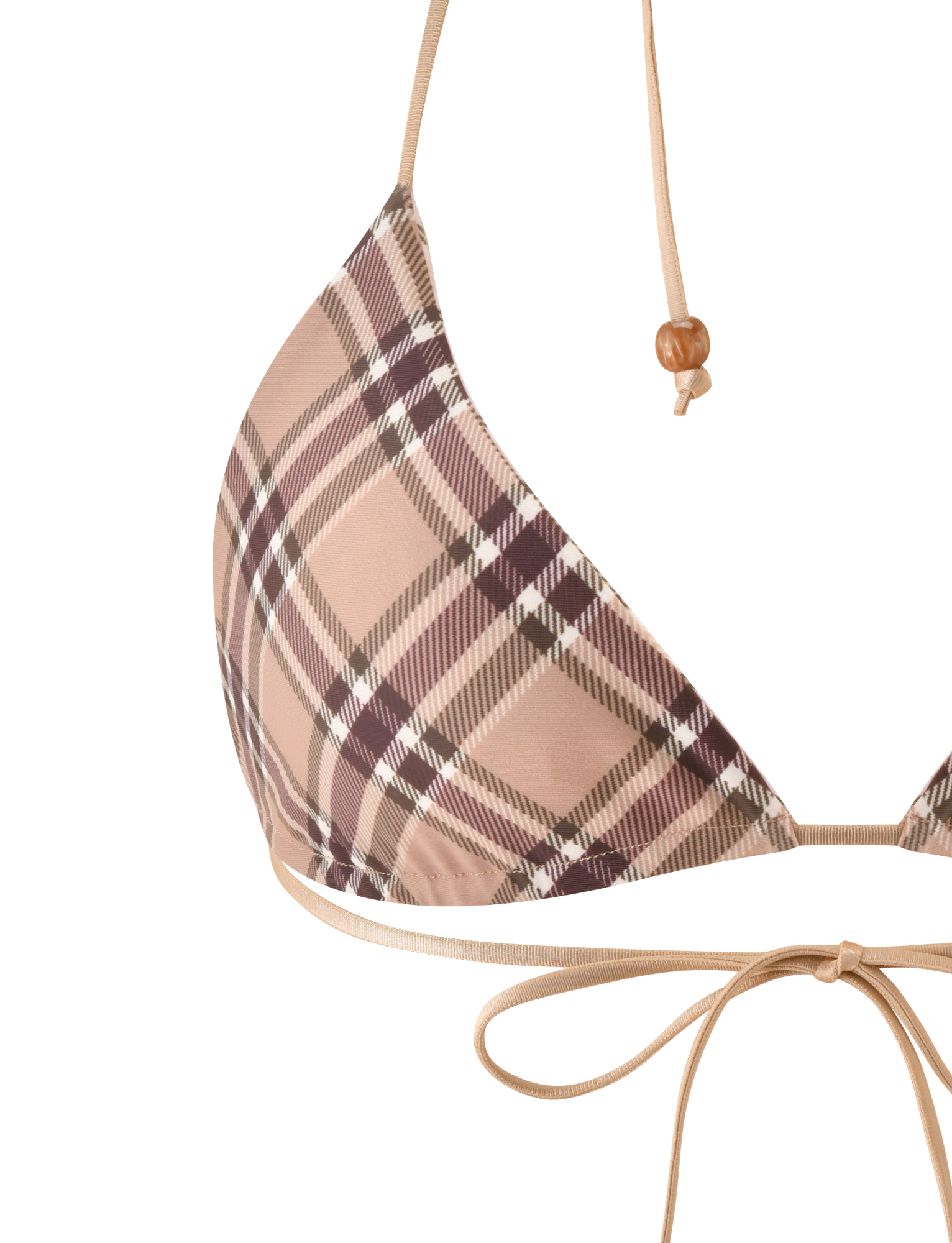 Close-up of the TIGERMIST AVE REVERSIBLE BIKINI TOP in tan and pink plaid. It features thin beige straps, one with a wooden bead, and a bow tied at the bottom.
