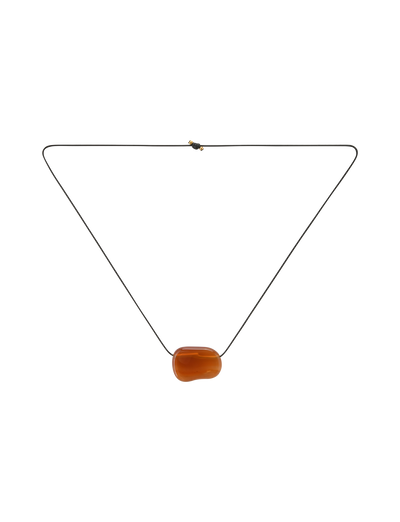 The ALILAH NECKLACE - AMBER by TIGERMIST is a minimalist black cord necklace with a single smooth amber pendant, designed to be adjustable for the perfect fit.
