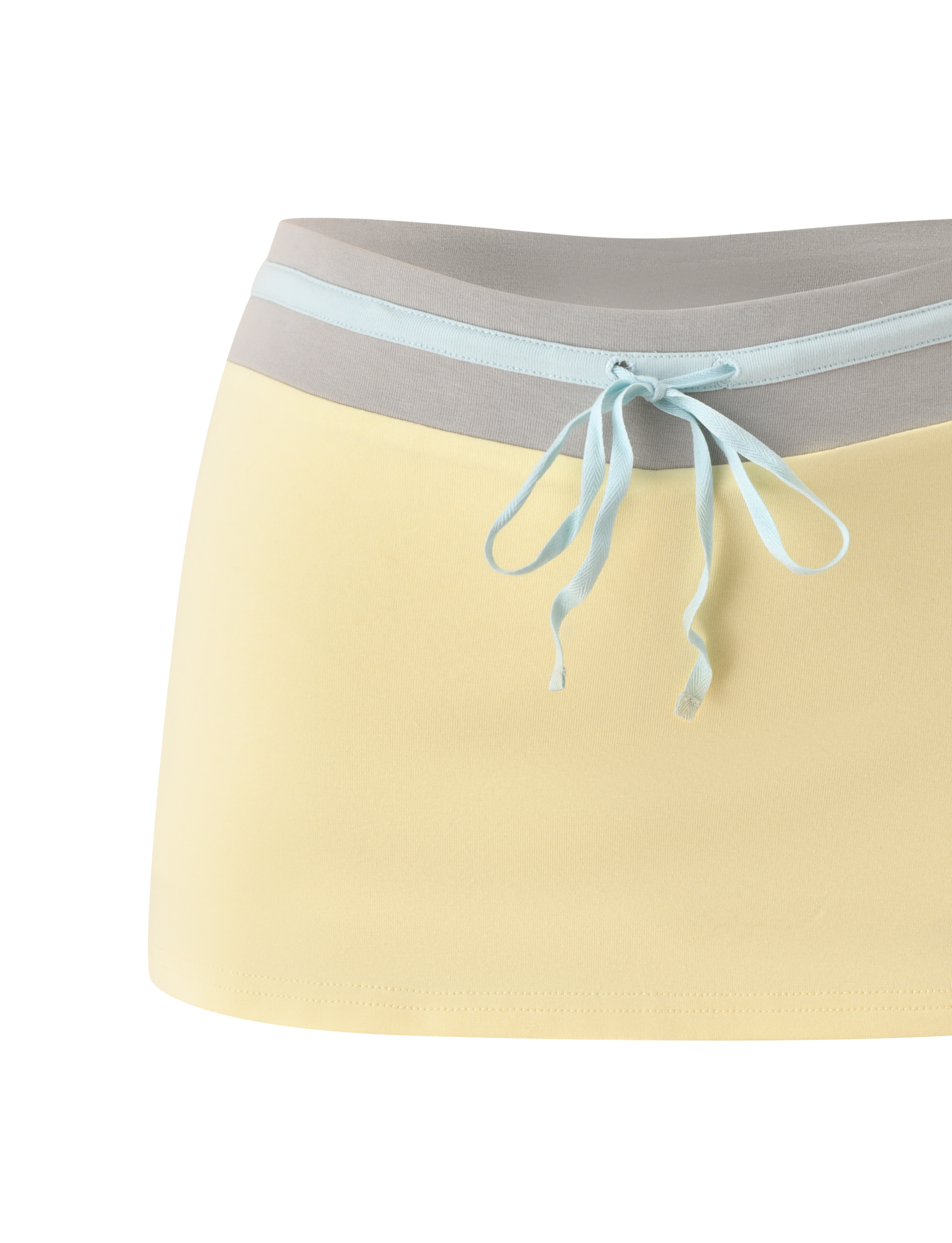 The TIGERMIST COLLINS SKORT - BUTTER features a contrast gray waistband and a light blue bow at the front.