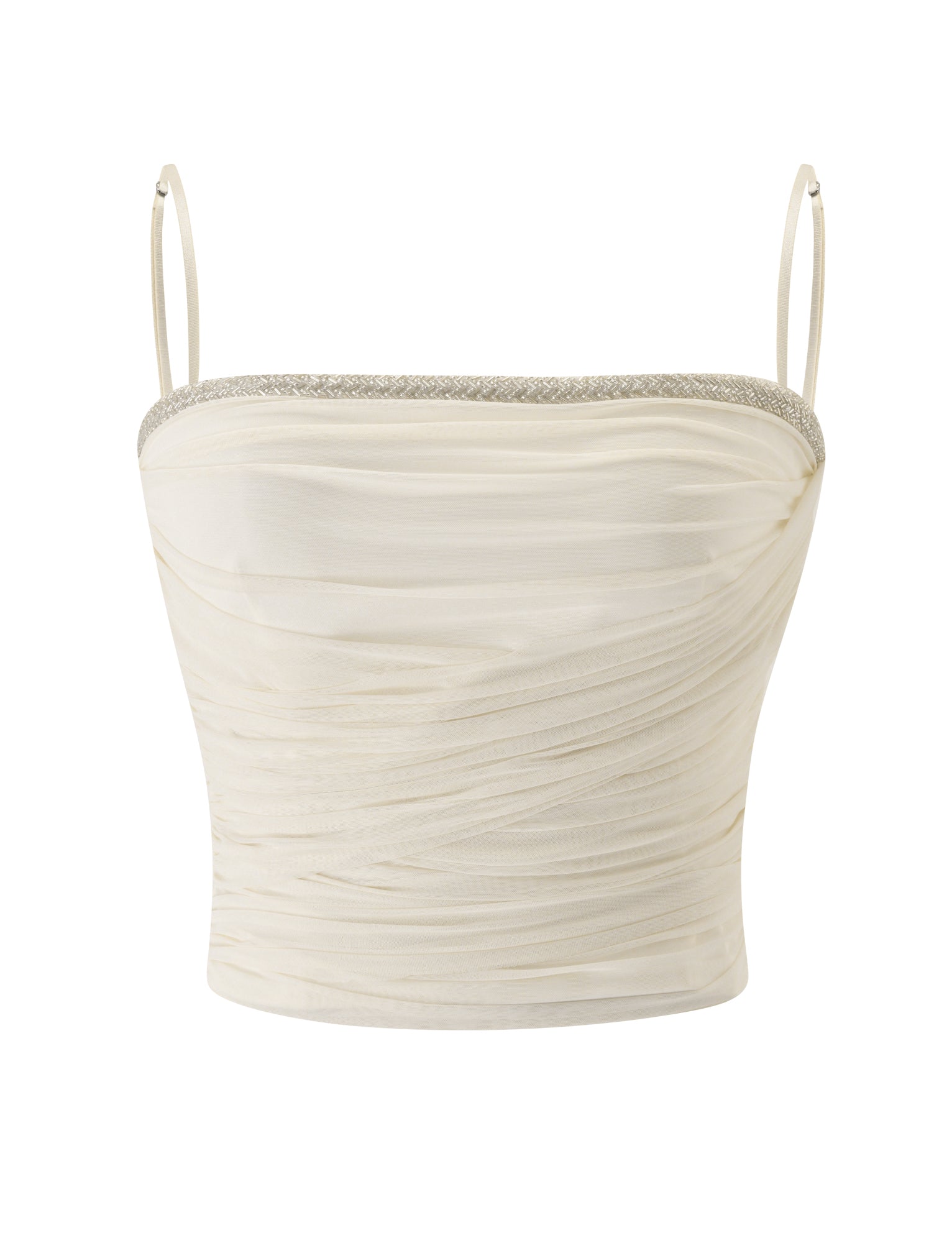 The JUNA TOP - CREAM by TIGERMIST is a cream-colored ruched crop top featuring adjustable spaghetti straps and a subtle shimmer along the neckline, displayed on a white background.