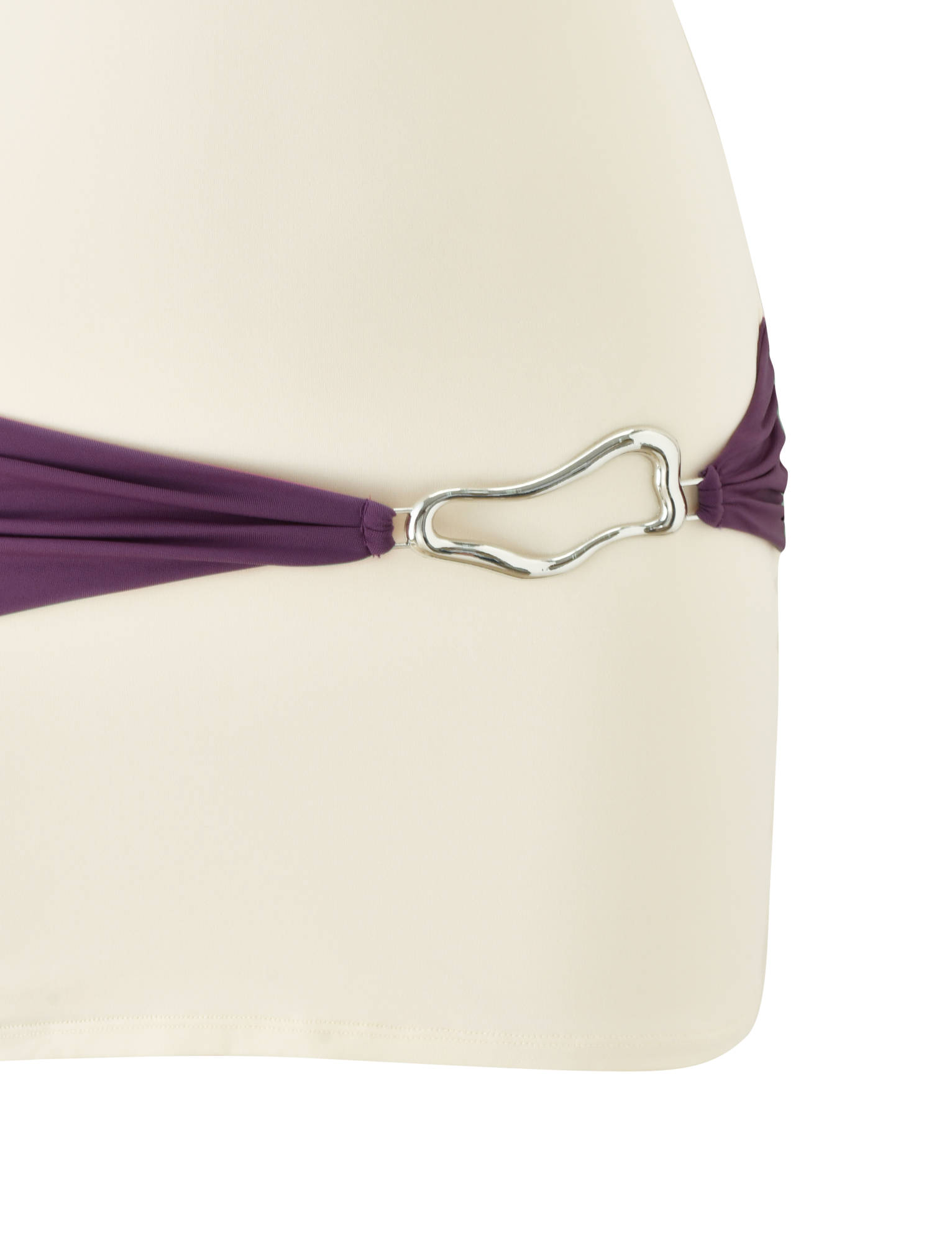 A close-up of the TIGERMIST EOS MINI DRESS in cream and dusty lilac, featuring a silver wavy metal ring connecting a dark purple strap to cream fabric, echoing chic color-blocked design details.