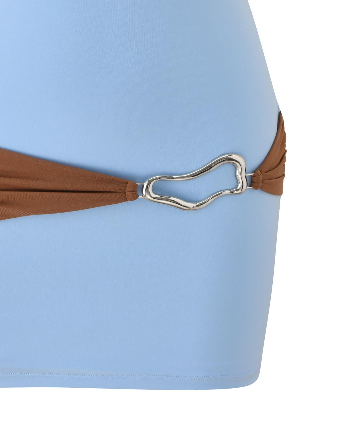 A close-up of the TIGERMIST EOS MINI DRESS in soft blue and mocha, featuring a brown hip strap with a silver, abstract-shaped metal buckle.