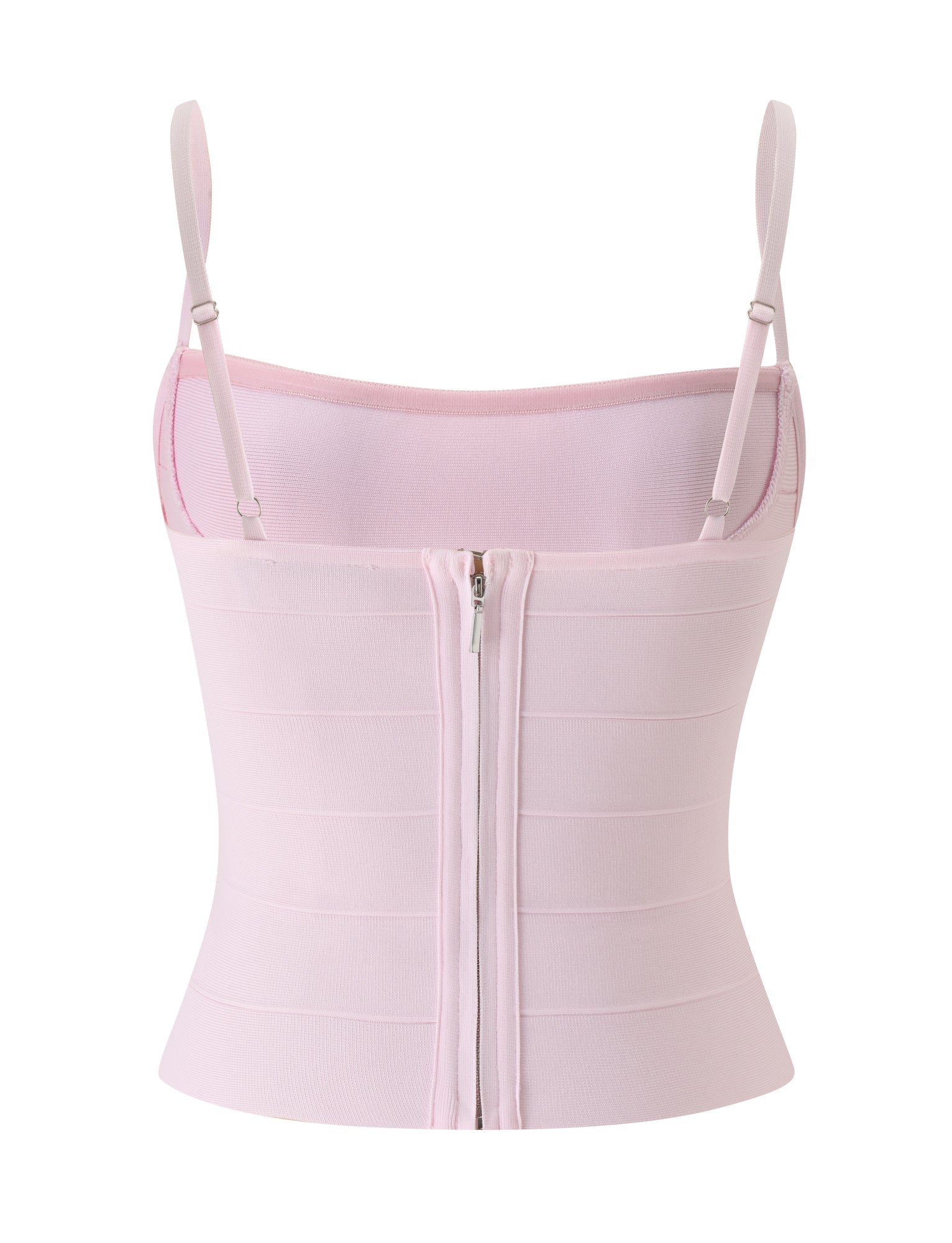 Introducing the TAHNIA BANDAGE TOP in Ballet Pink by TIGERMIST—a light pink, fitted sleeveless top with a bodycon silhouette and adjustable spaghetti straps. This structured piece features horizontal paneling for a subtle corset-inspired shape, and is finished with a visible zipper down the back.