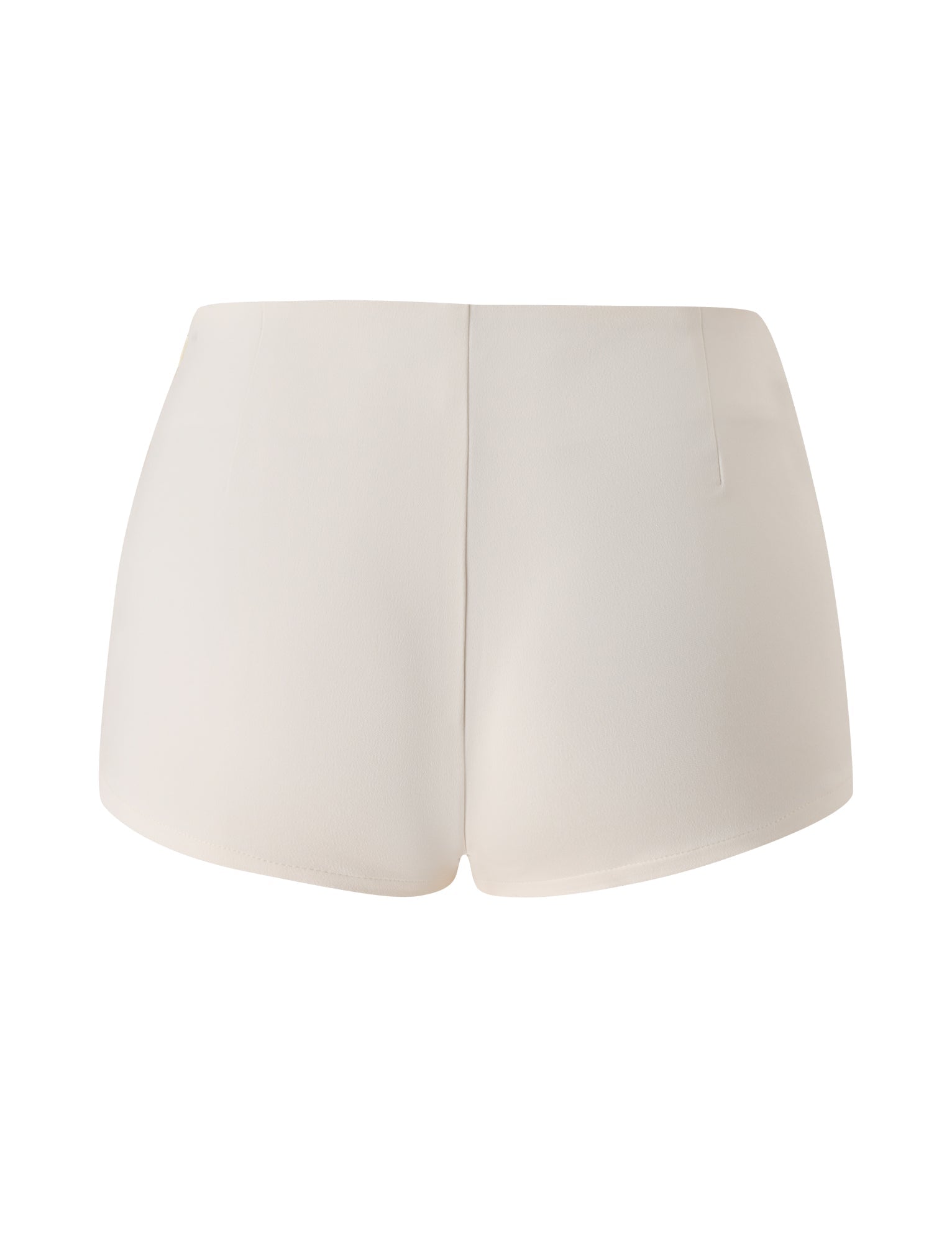 Back view of the TIGERMIST KITTIE BUCKLE SHORT in cream—a pair of high-waisted mini shorts made from stretch suiting fabric, showcasing a smooth texture and clean, minimal design with no visible pockets or embellishments.