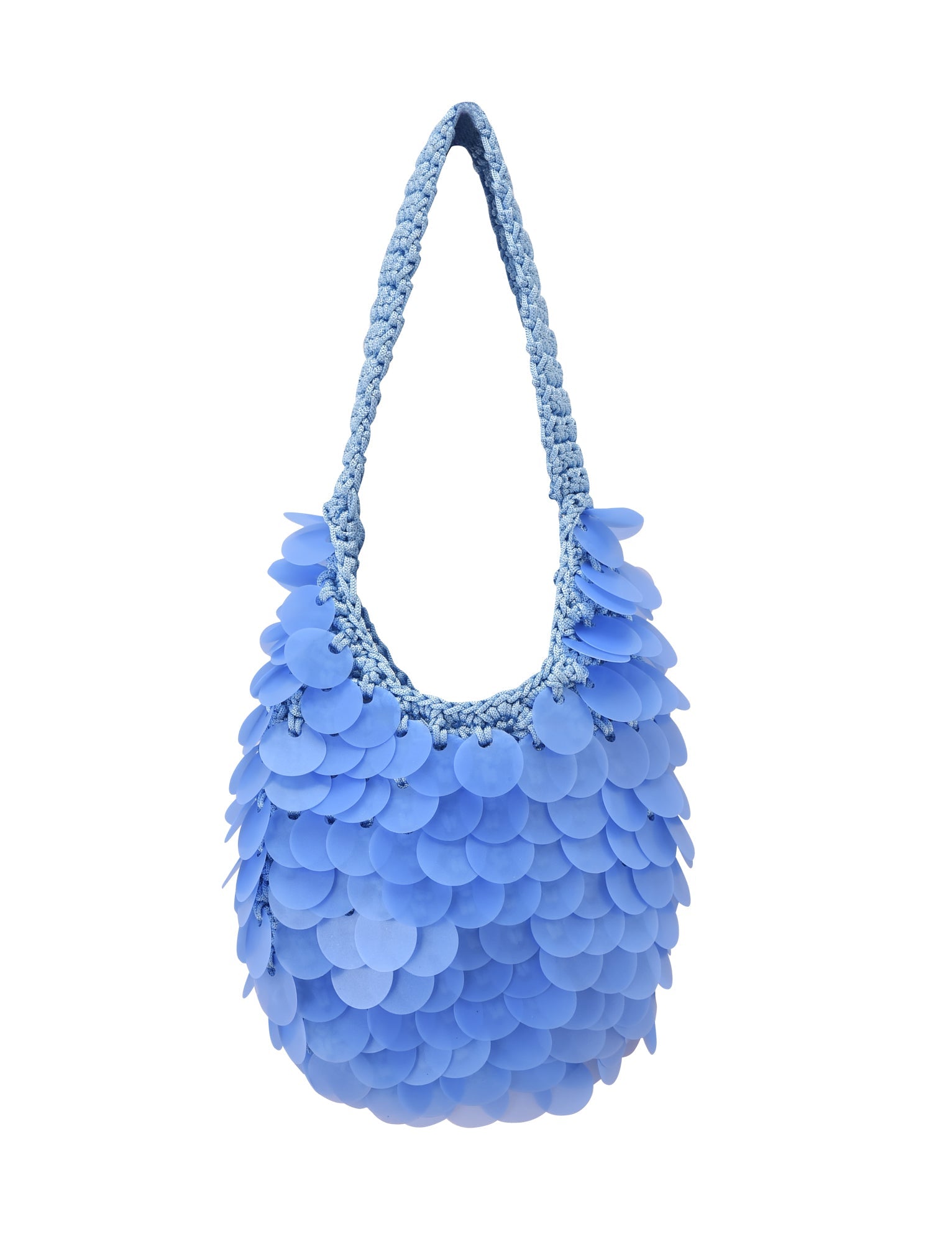 The CLEO BAG - BRIGHT BLUE by TIGERMIST features a braided handle and is adorned with overlapping circular blue discs reminiscent of sequins, creating a textured and playful look—ideal as a statement beach bag—shown against a white background.
