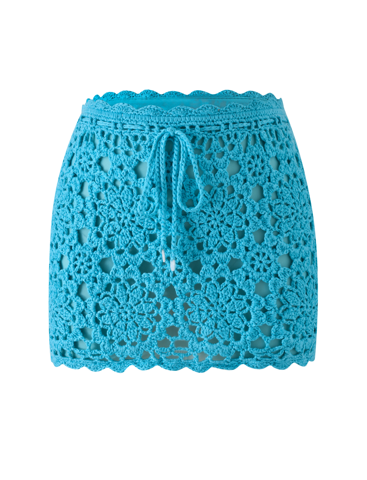 SASHA CROCHET MINI SKIRT - AQUA featuring a floral pattern and a drawstring waist, perfect as a vacation skirt.