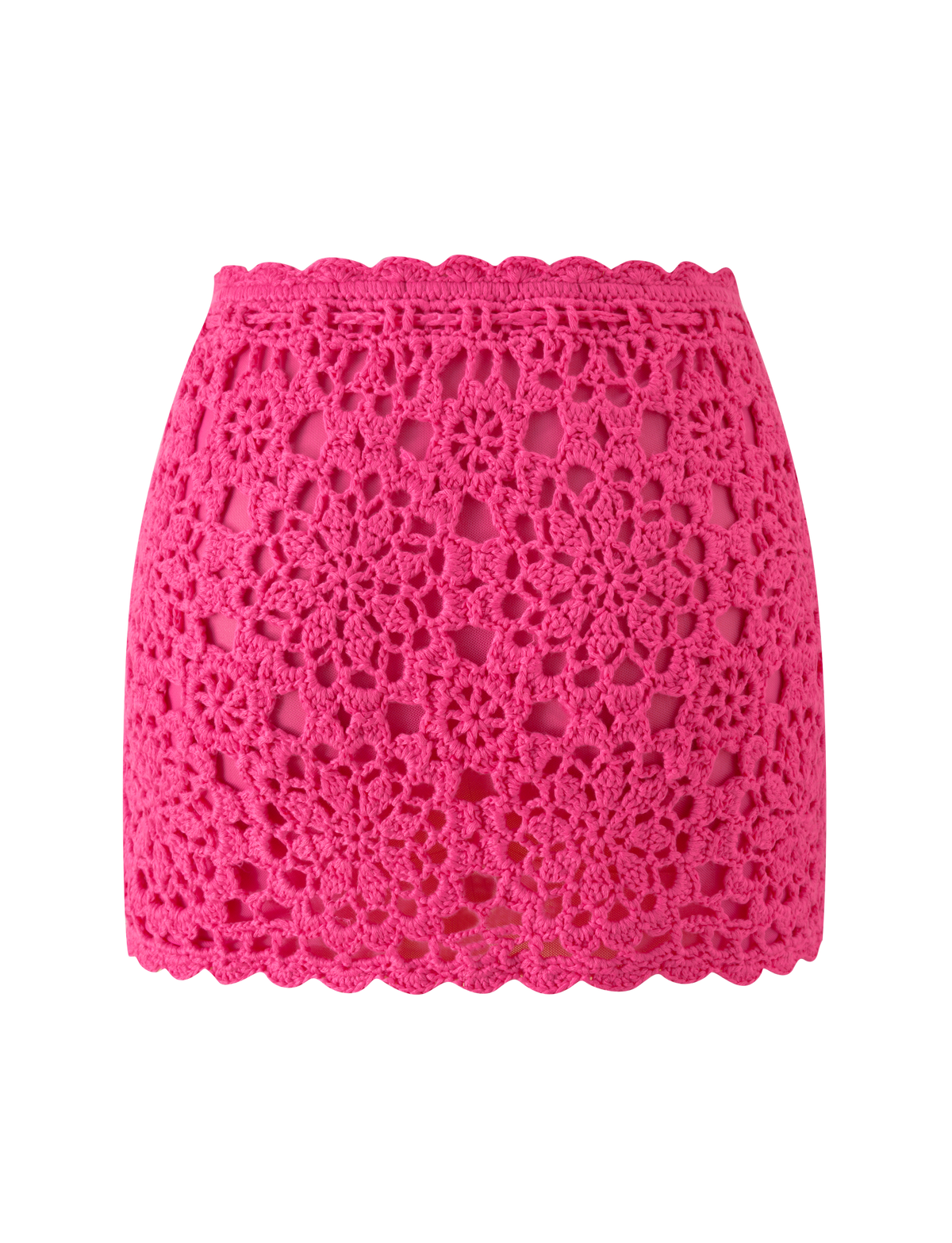 The SASHA CROCHET MINI SKIRT - HOT PINK by TIGERMIST features a bright floral lace pattern and scalloped edges, perfect for vacations, shown against a plain white background.