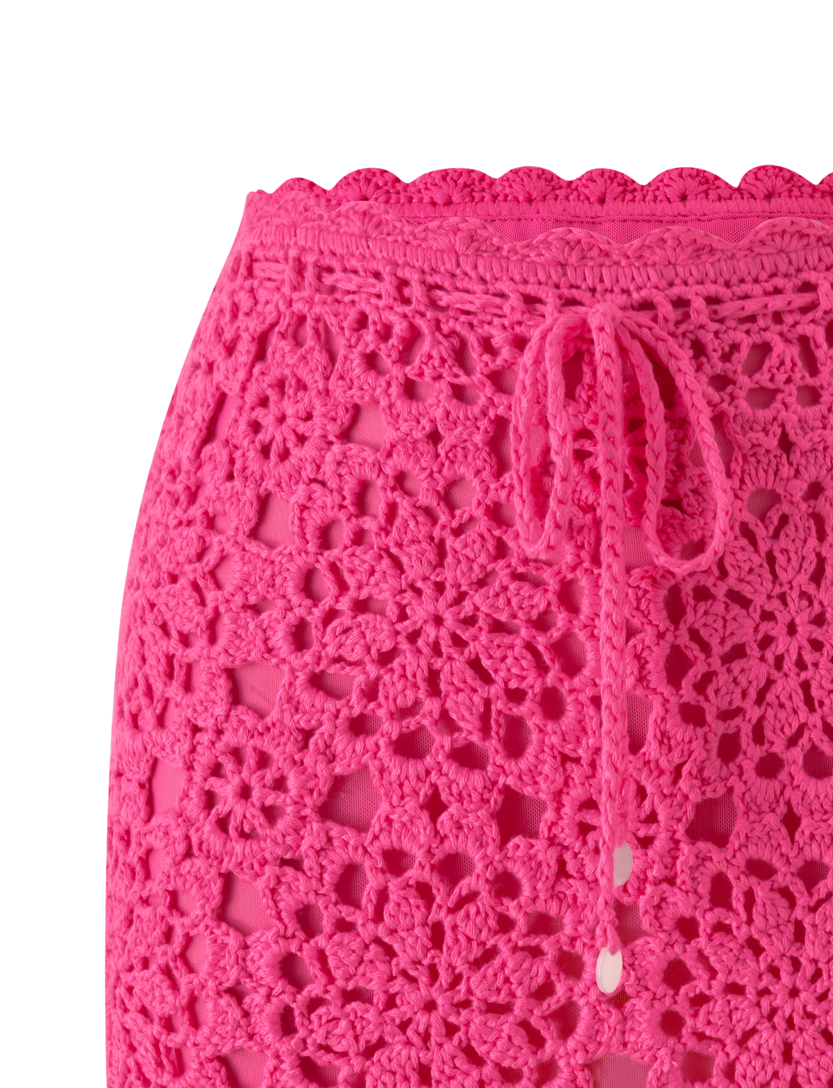 Close-up of the SASHA CROCHET MINI SKIRT - HOT PINK by TIGERMIST, featuring a drawstring waistband and intricate floral crochet, ideal as a vacation skirt, shown on a white background.