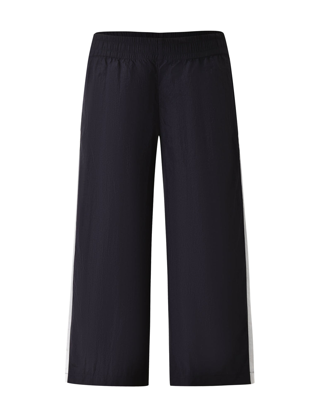 The SOPHIA WINDBREAKER CAPRI by TIGERMIST features a navy windbreaker fabric with an elastic waistband and striking wide white side stripes, shown against a white background.