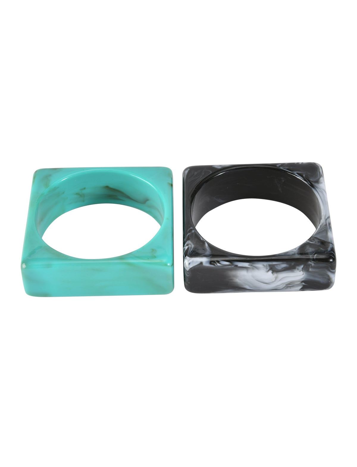The AUGIE BANGLE SET - EMERALD AND BLACK by TIGERMIST features two geometric acrylic bangles, one emerald with a marble effect and one black with white marbling, displayed side by side on a white background.