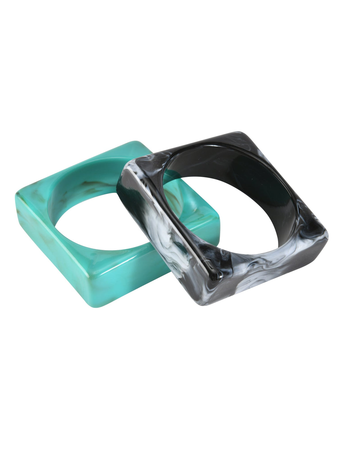Two geometric bangles—one emerald and one with a bold black marble effect—overlap on a white background, making the AUGIE BANGLE SET - EMERALD AND BLACK by TIGERMIST a standout accessory.