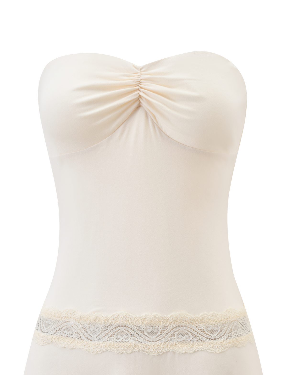 A close-up of the TIGERMIST DELARA DRESS in cream, a strapless mini dress featuring bust ruching, a lace waist insert, and a figure-hugging silhouette.