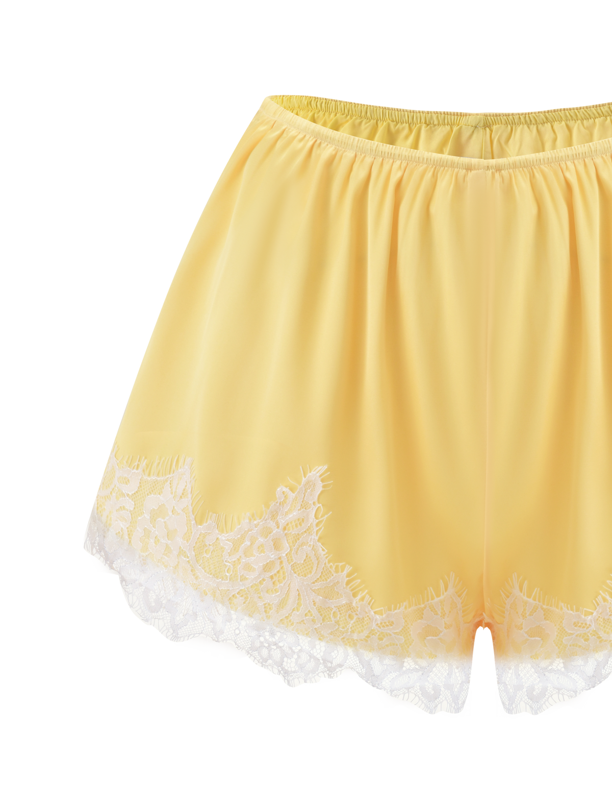 The SOLSTICE SHORT - YELLOW by TIGERMIST features yellow satin fabric, an elastic waistband, and white lace trim at the hem. The soft, lightweight shorts offer a delicate, feminine look against a plain white background.