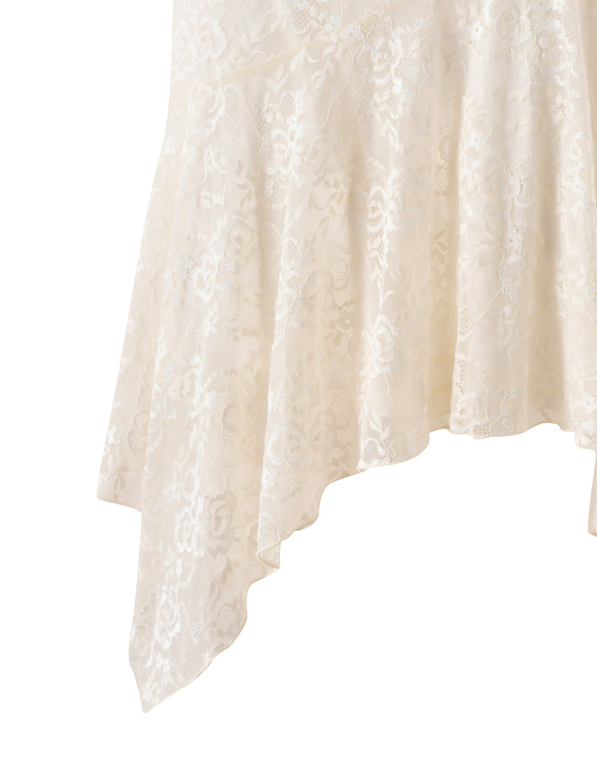 Close-up of the hem of the TIGERMIST TONYA MIDI SKIRT in cream, featuring a handkerchief-style asymmetrical edge—perfect for a romantic dinner outfit.