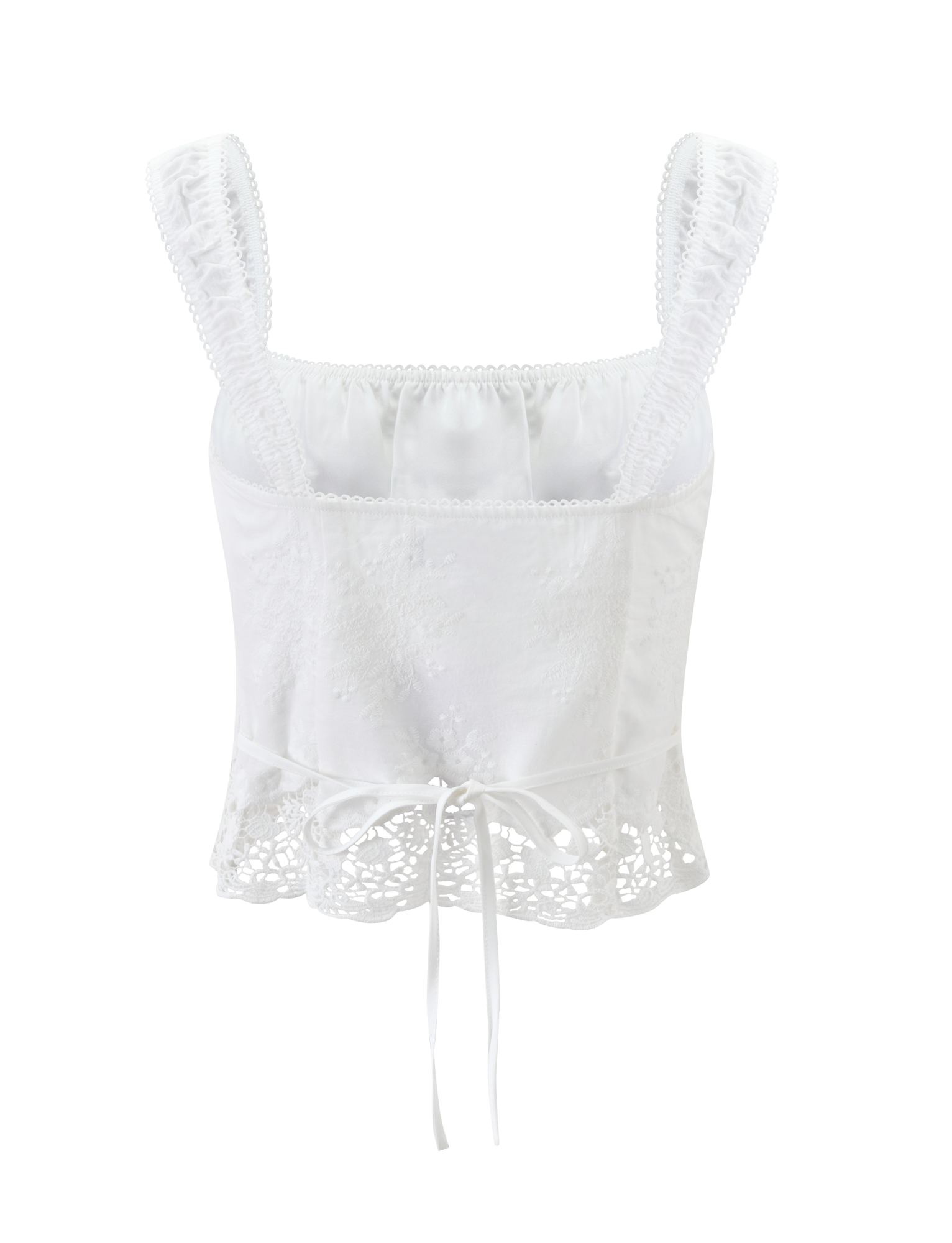 The ELENAI TOP - WHITE by TIGERMIST is a white lace tank with a ruched bust, wide straps, square neckline, floral embroidery, and a ribbon tie waist, shown against a plain white background.