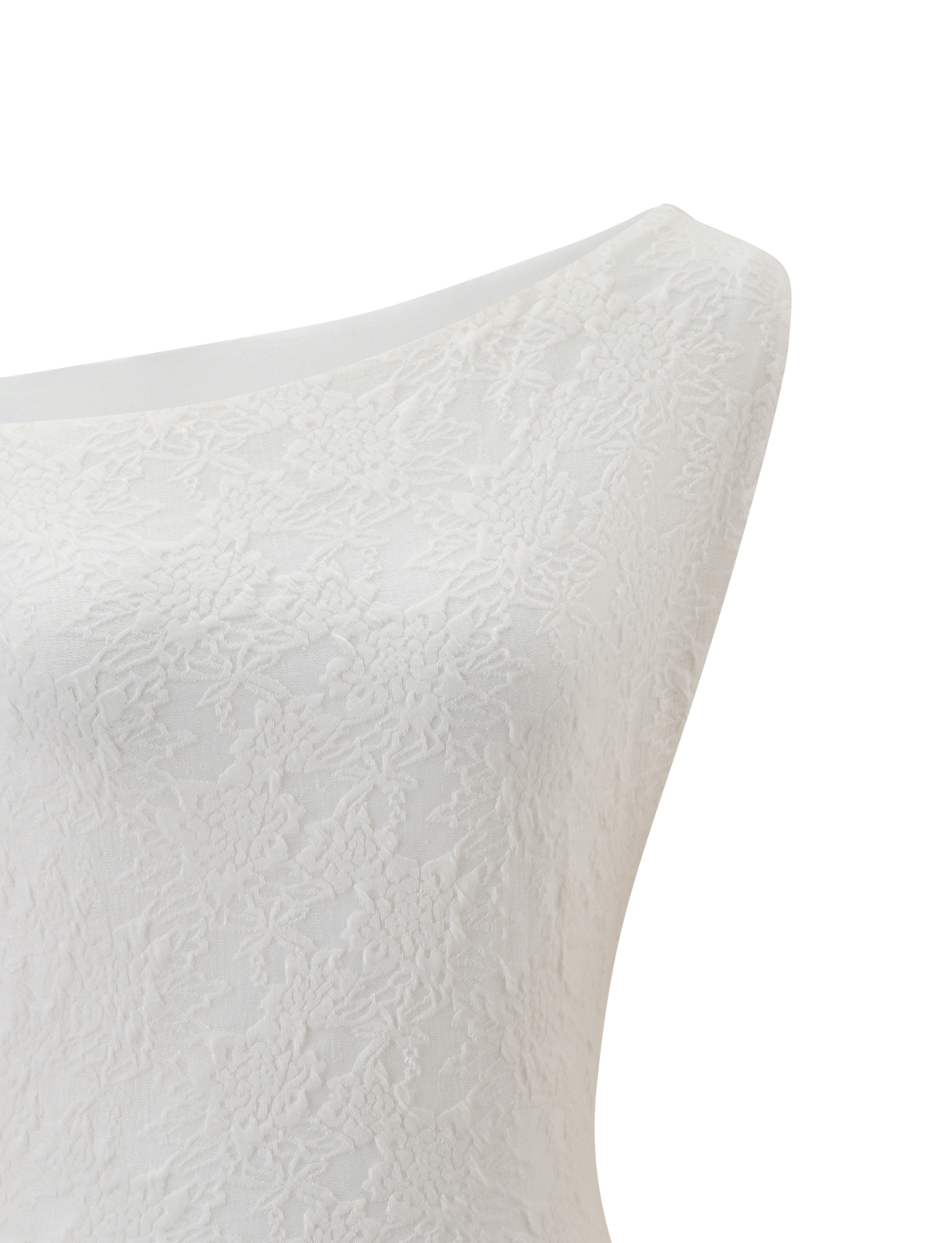 Close-up of the TIGERMIST MAVEN LACE TOP in ivory, featuring a subtle floral texture, displayed on a mannequin against a plain white background.