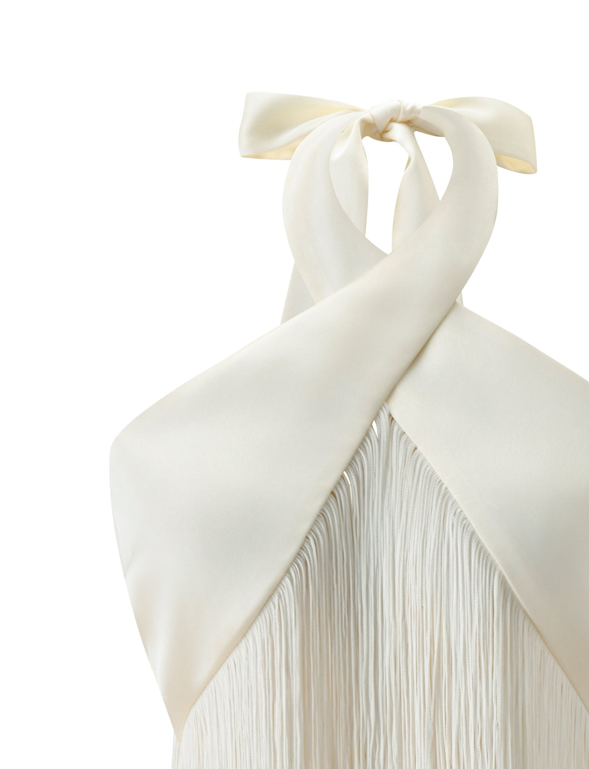 ALINDA TOP - CREAM crop length halter top with a criss-cross neckline and a long fringe overlay.