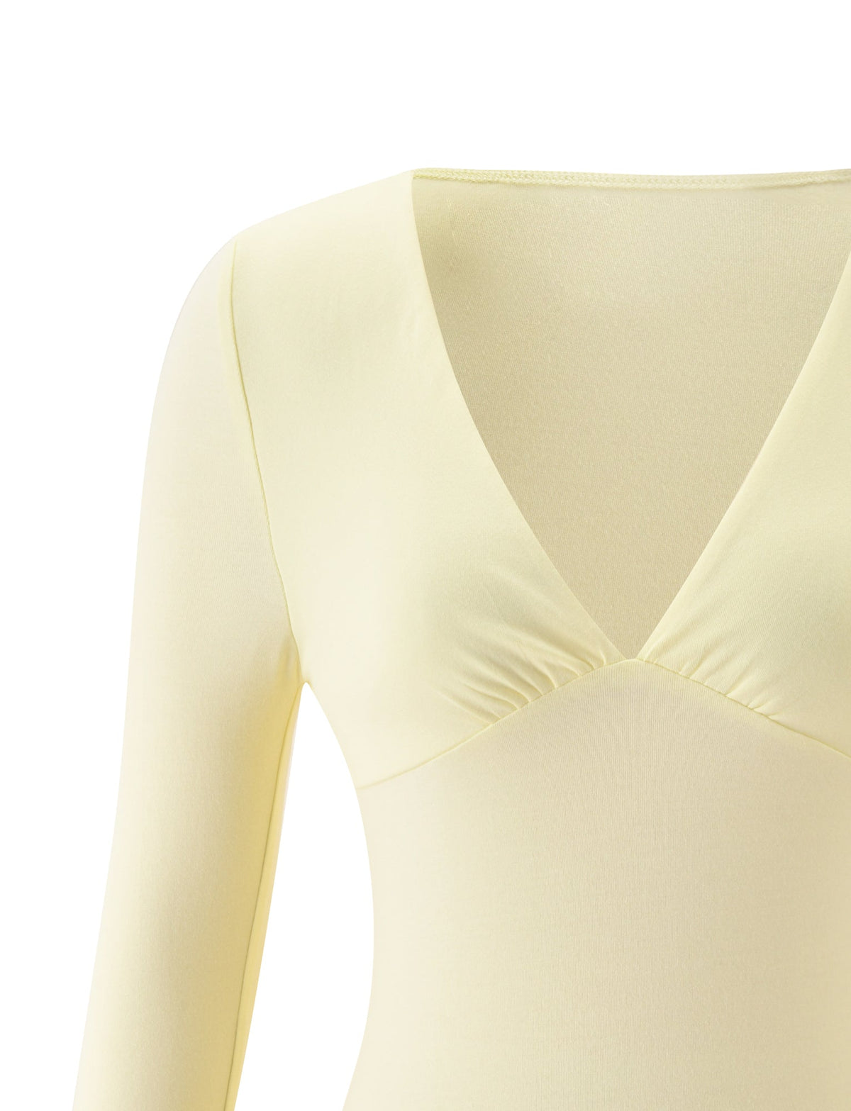 A close-up of the SANDI TOP in butter yellow by TIGERMIST, featuring long sleeves and a flattering V-neckline. The image highlights the upper torso and neckline of the top against a plain white background, making it an ideal choice for brunch attire.