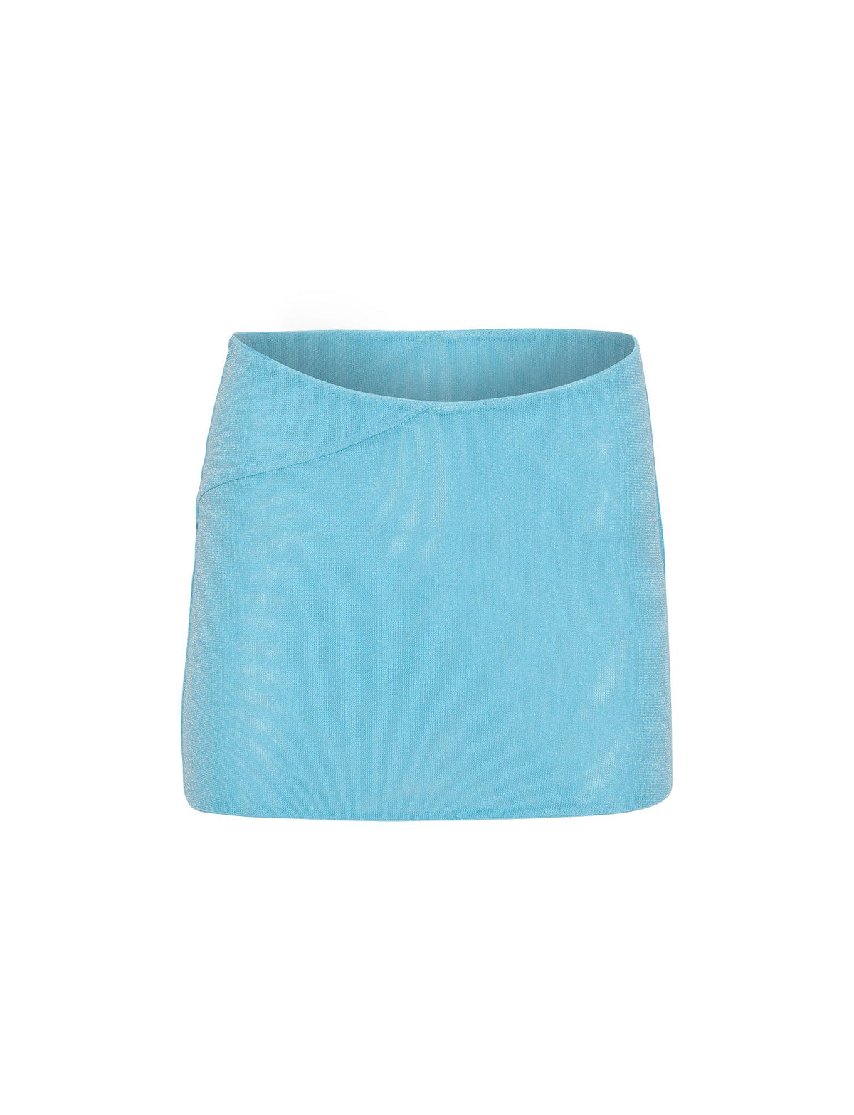 The COBI SKIRT - SHIMMER from TIGERMIST is a light blue mini skirt with a subtle sheen and sleek, minimalist design. It features a smooth surface with a slight diagonal seam detail on the upper left side and an elastic waistband for a snug fit.