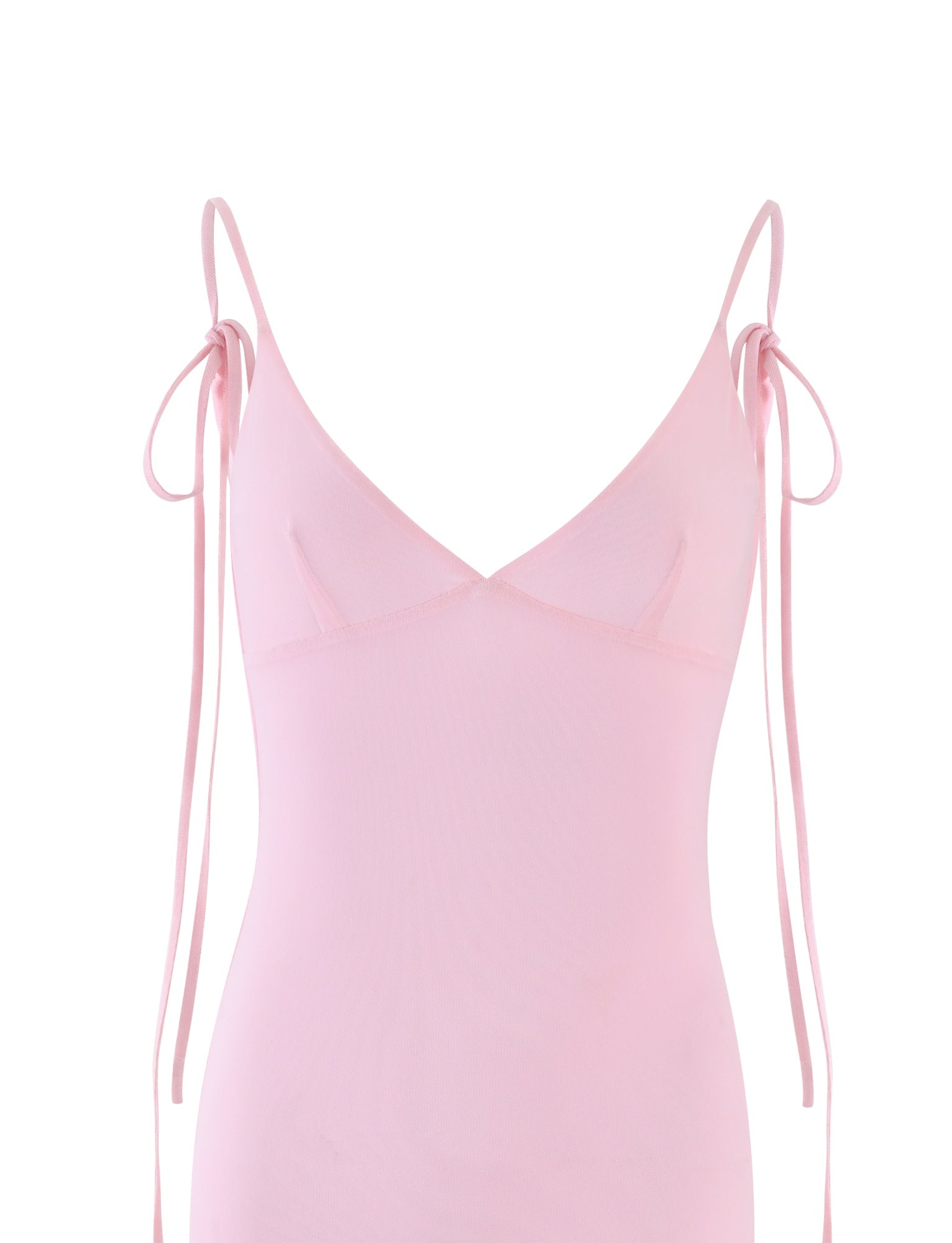 A Baby Pink sleeveless spaghetti strap dress with a deep V-neckline from TIGERMIST. The thin straps tie into bows at the shoulders. The form-fitting KYLAH DRESS - PINK is made of a semi-sheer fabric, set against a plain white background.
