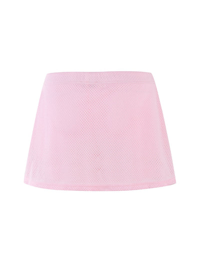 The NYDIA SKORT from TIGERMIST in blush, dusty pink is presented against a white background. This short mesh skort features a simple design with an elastic waistband. The semi-transparent, lightweight fabric creates a slightly see-through effect.