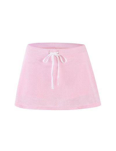 A NYDIA SKORT - PINK : BLUSH : DUSTY PINK from TIGERMIST, featuring a drawstring waistband, is displayed against a plain white background. The skort has a lightweight and airy appearance with visible perforations typical of mesh fabric.