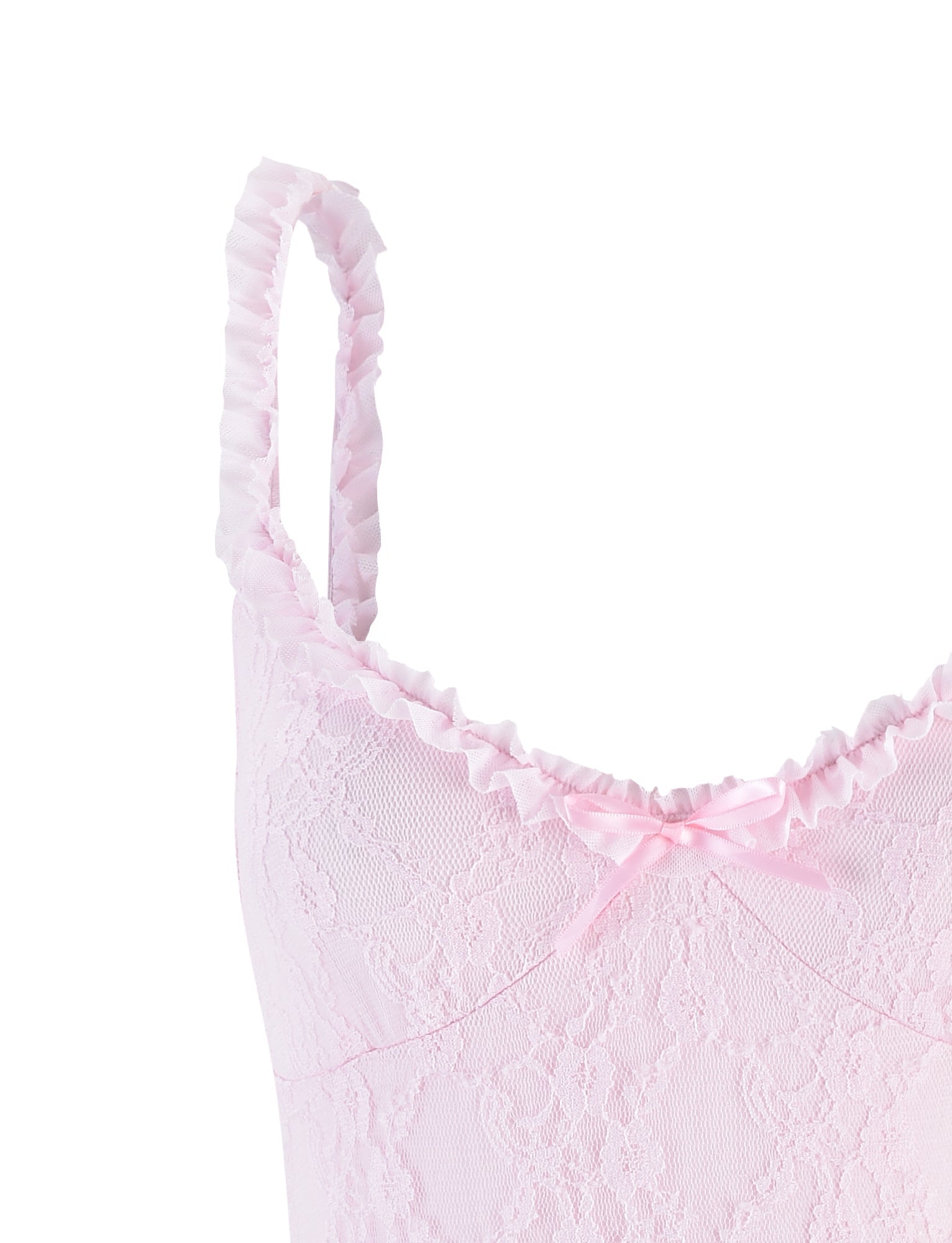 A close-up of the DEJA BODYSUIT - PINK: PASTEL PINK from TIGERMIST, featuring a light pink lace with ruffled trim along the top edge and shoulder straps. A small pink bow is centered on the neckline. The lace displays a delicate floral pattern, set against a plain white background.
